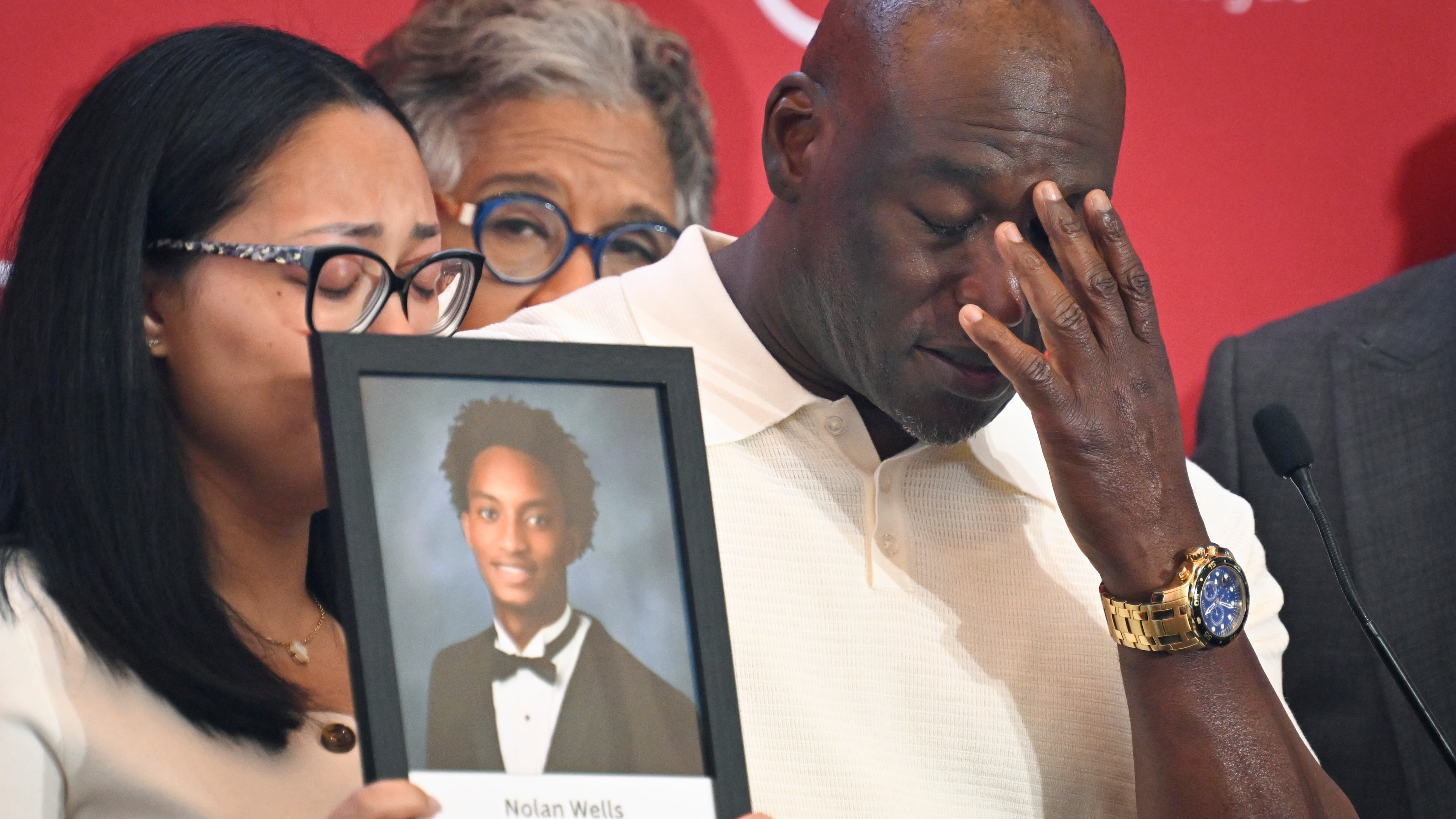 Elmore Wonsley, right, pauses from speaking as wife Christine Wonsley holds a photo of her deceased son, Nolan Wells, as they appear at the National Urban League's annual conference, Thursday, July 30, 2026, in Nashville, Tenn. (AP Photo/John Amis)