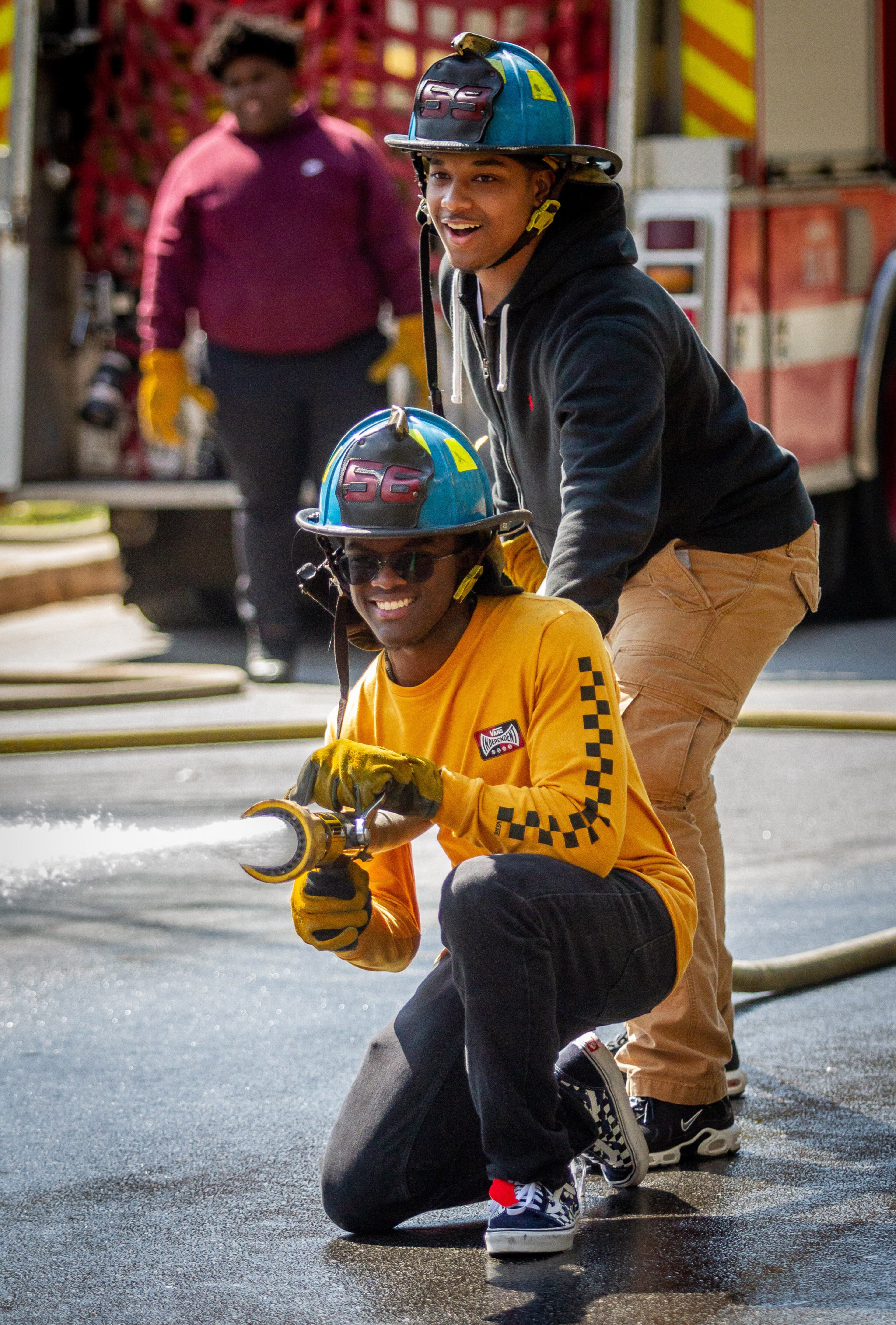 Therrell High School senior DeiAndre Penny and Marquis Lowe participate in the Atlanta Fire departments Delayed Entry Program training at there high school Thursday, March 21, 2019. STEVE SCHAEFER / SPECIAL TO THE AJC