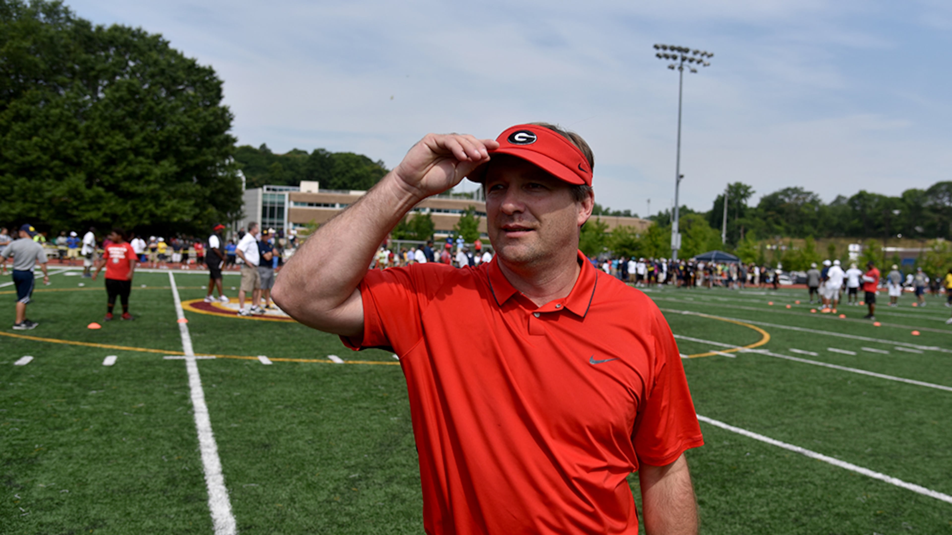 Georgia head football coach Kirby Smart directs recruits during the Next Level Elite Football Camp Thursday, June 2, 2016, at Maynard Jackson High School in Atlanta. More than 100 potential college recruits attended the event co-hosted by Michigan head coach Jim Harbaugh.
