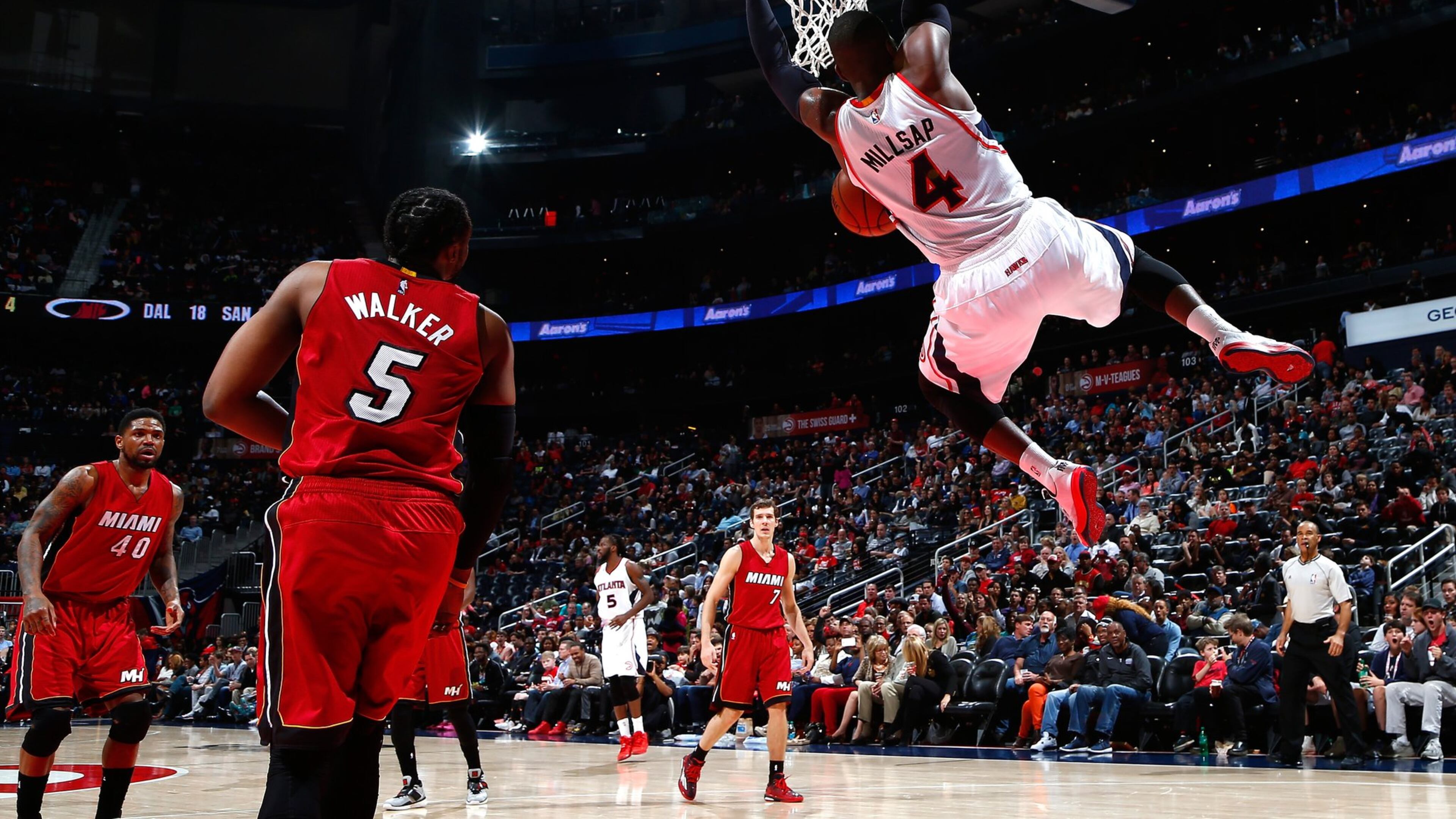The Hawks’ Paul Millsap dunks off an alley-oop pass against the Heat’s Henry Walker during a game at Philips Arena. (Photo by Kevin C. Cox/Getty Images)