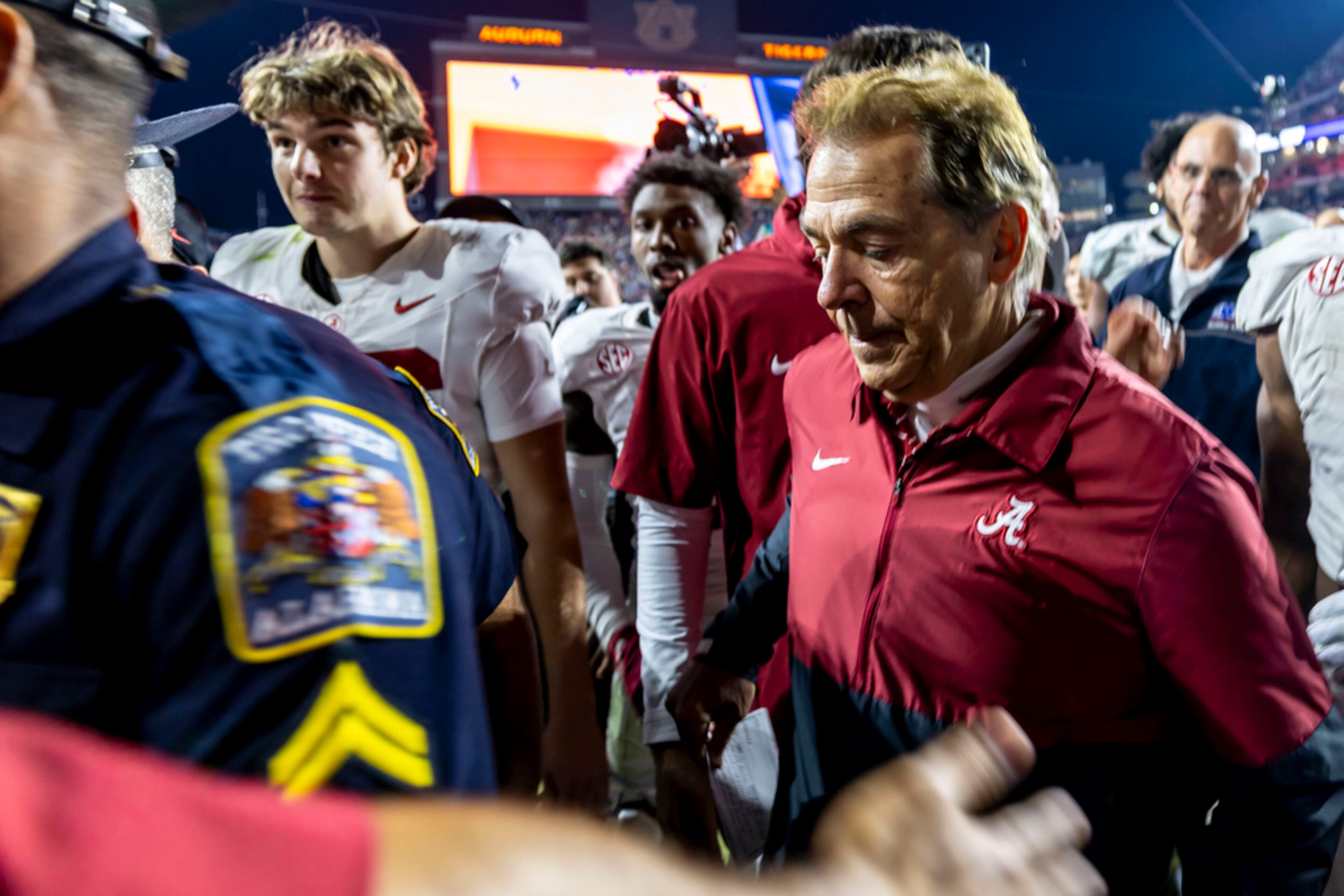 Alabama head coach Nick Saban, front right, departs the field after an NCAA college football game against Auburn, Saturday, Nov. 25, 2023, in Auburn, Ala. (AP Photo/Vasha Hunt)