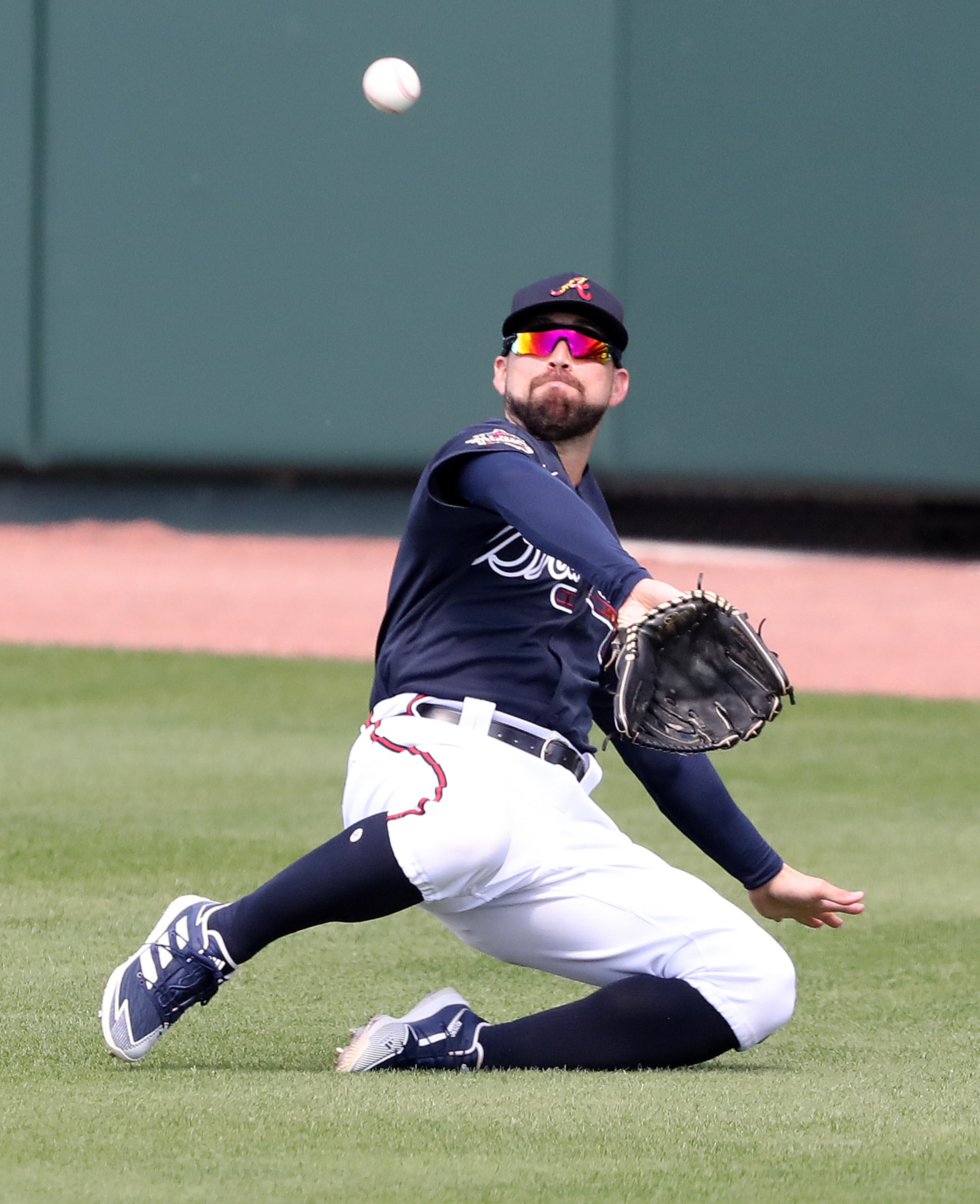 030221 North Port: Atlanta Braves center fielder Ender Inciarte makes the sliding catch on a long fly by Minnesota Twins Max Kepler to end the second inning during a MLB spring training baseball game at CoolToday Park on Tuesday, March 2, 2021, in North Port. Curtis Compton / Curtis.Compton@ajc.com”