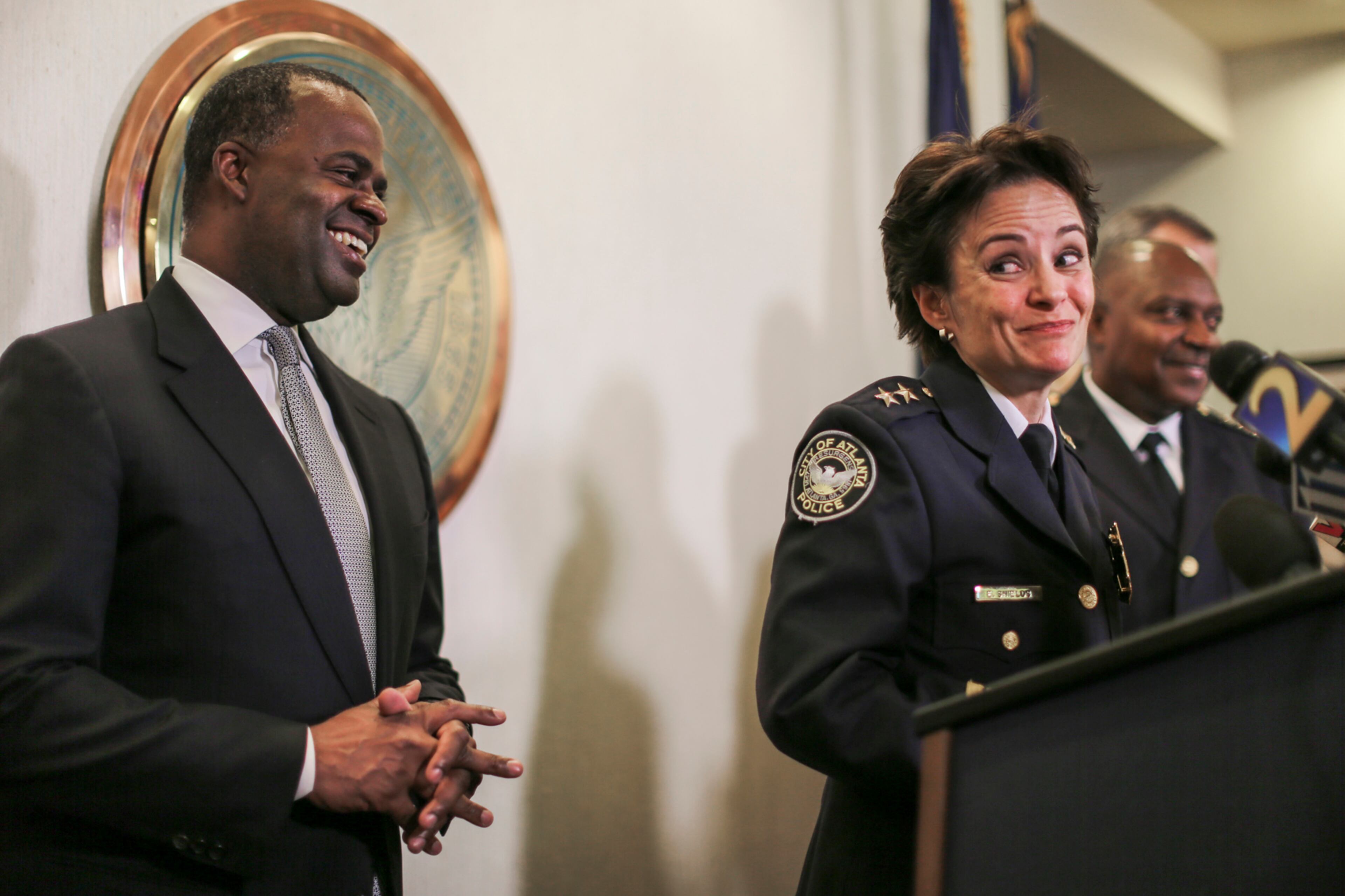 December 1, 2016 Atlanta: Left to right - Mayor Kasim Reed, deputy chief Erika Shields, APD police chief, George Turner at a city hall press conference Thursday, Dec. 1, 2016 where deputy Deputy chief Erika Shields was named Atlanta's 24th chief of police Thursday, replacing George Turner who is retiring. Shields joined the Atlanta Police Department in 1995. During her tenure she has served as a Patrol Officer, Sergeant, Lieutenant, and Major prior to her appointment to Deputy Chief. She currently serves as the Deputy Chief of the Support Services Division. She will start the job on Dec. 28. "I am truly humbled, honored and grateful for this opportunity you have afforded me," she said following the announcement of her appointment. Turner was appointed the department's 23rd chief six years ago. His retirement after 35 years on the force was announced Wednesday. JOHN SPINK /JSPINK@AJC.COM