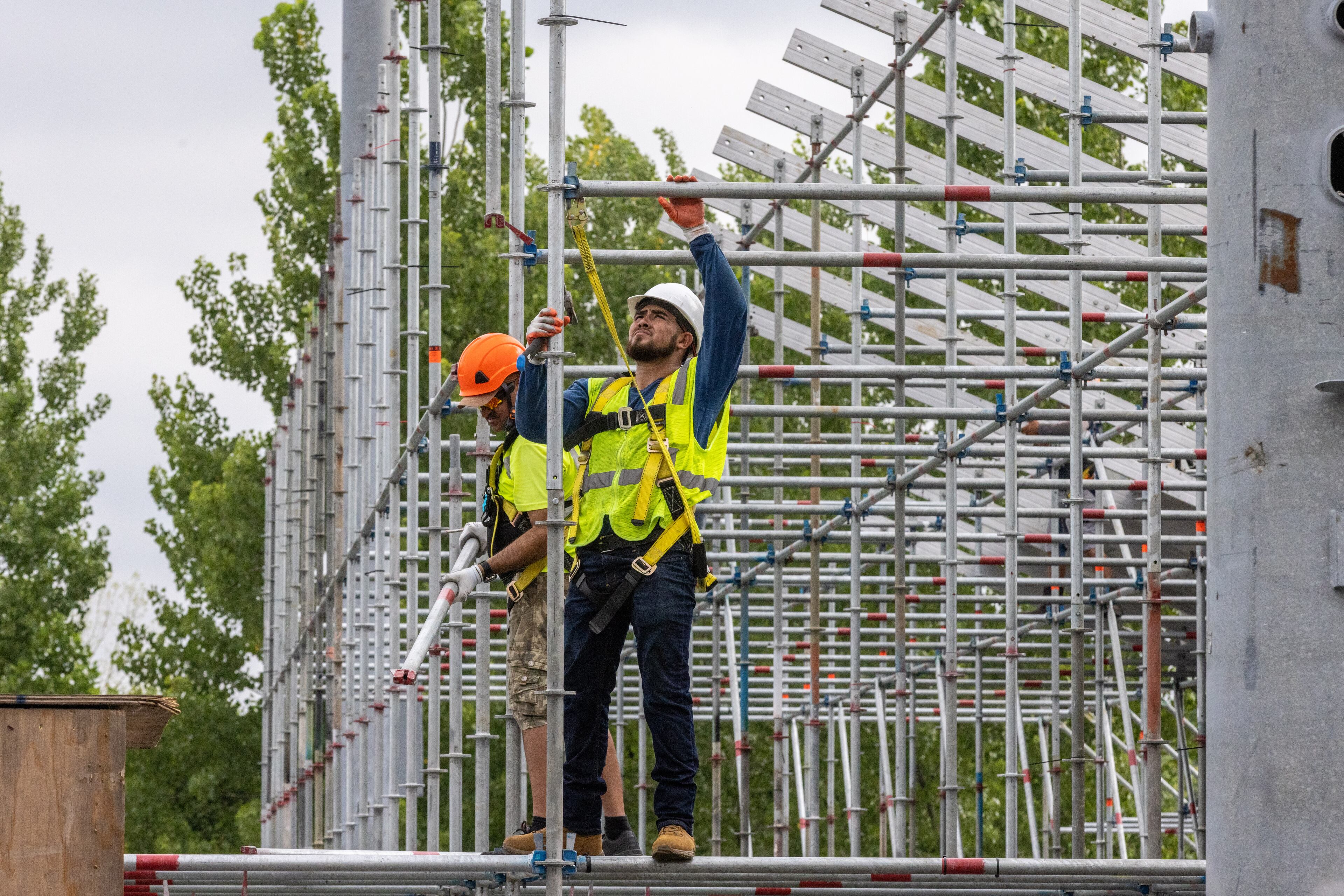 Workers construct the bleachers for The Atlanta Open, which will run from July 23rd through July 31st at Atlantic Station Tuesday, June 28, 2022. (Steve Schaefer / steve.schaefer@ajc.com)