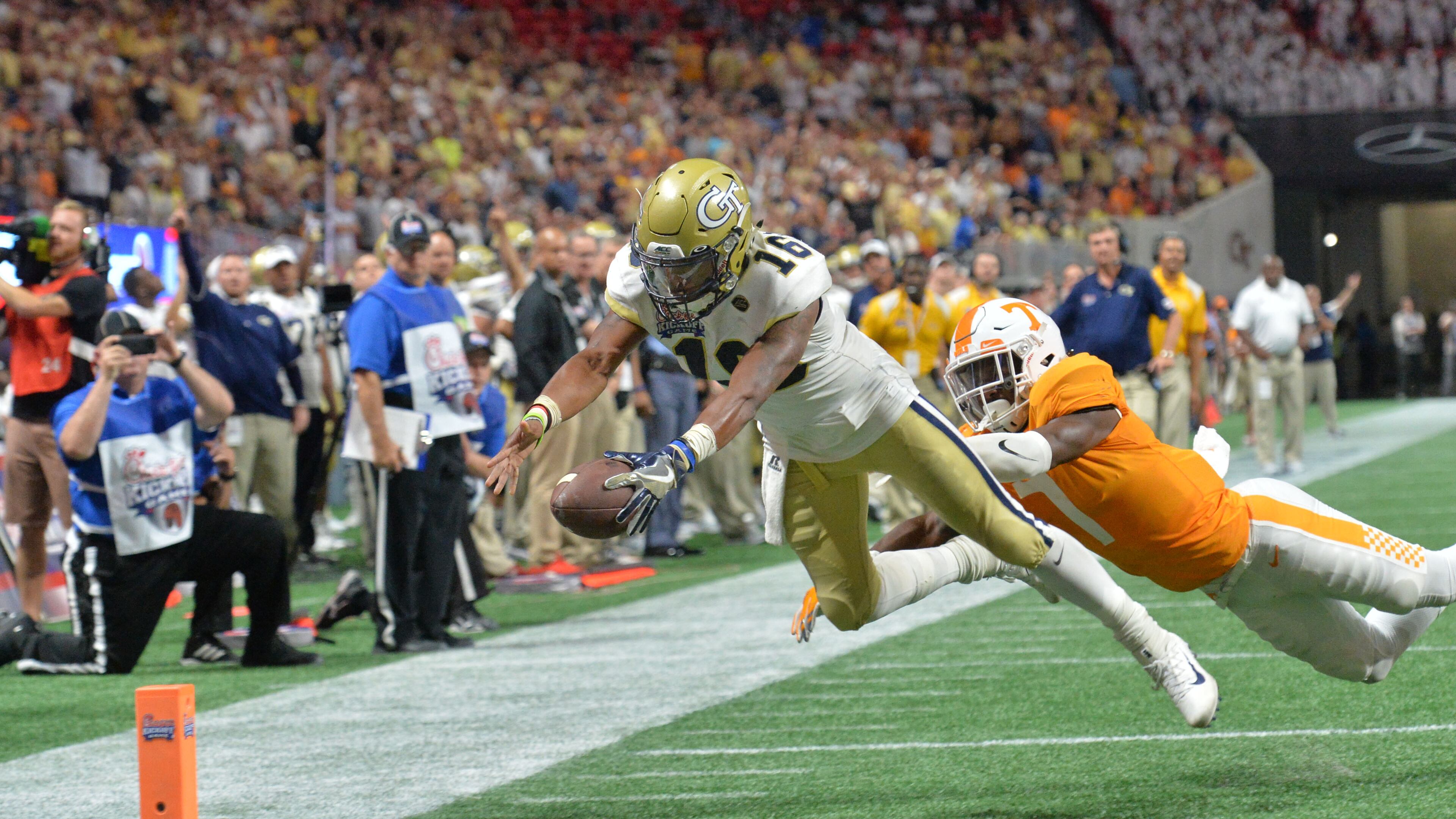 September 4, 2017 Atlanta - Georgia Tech quarterback TaQuon Marshall (16) dives past Tennessee defensive back Rashaan Gaulden (7) for a touchdown in the first half of NCAA college football game at the Mercedes-Benz Stadium on Monday, September 4, 2017. Tennessee won 42-41 over the Georgia Tech in double overtime. HYOSUB SHIN / HSHIN@AJC.COM