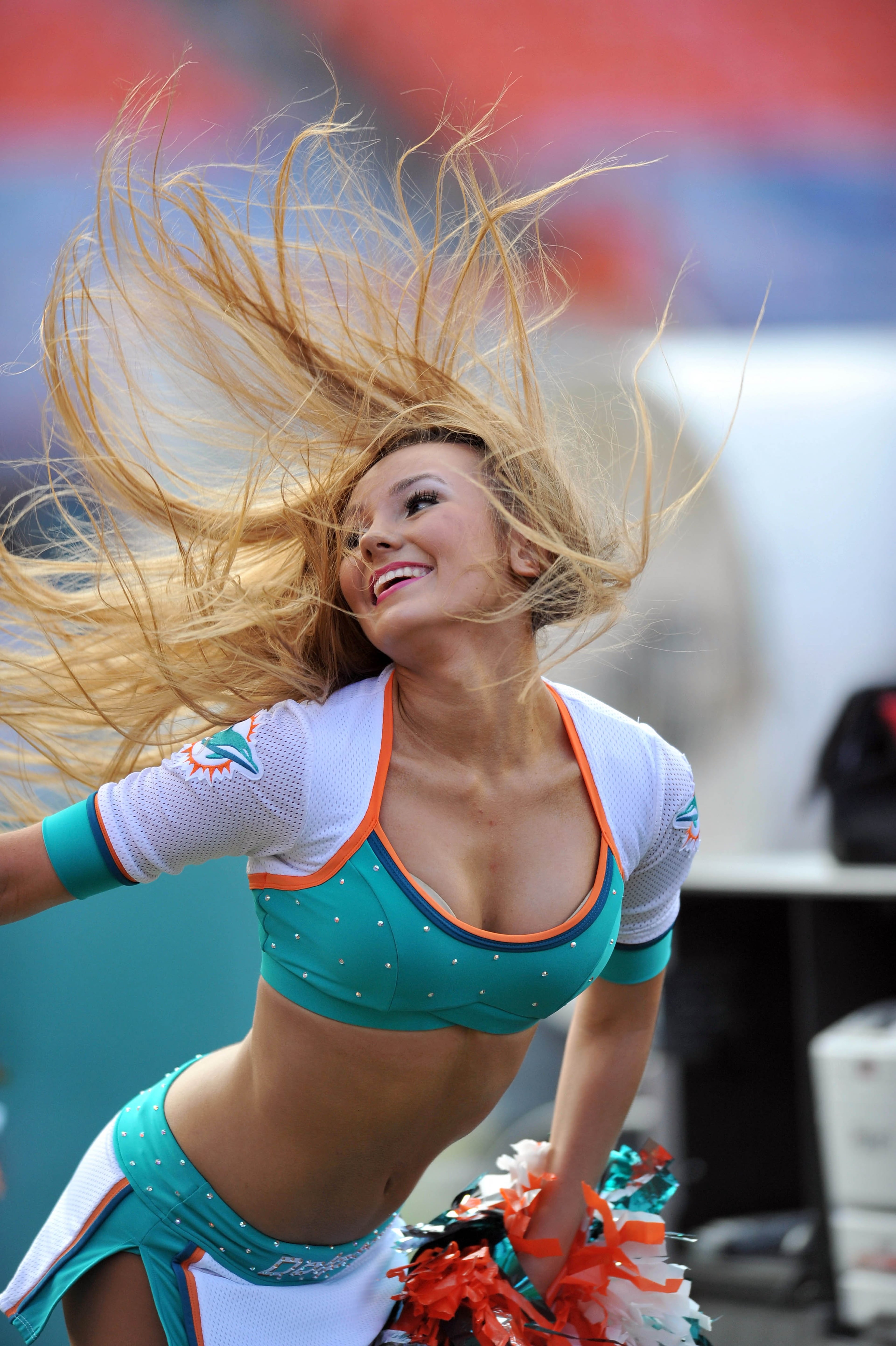A Dolphins cheerleader goes all out during a routine.