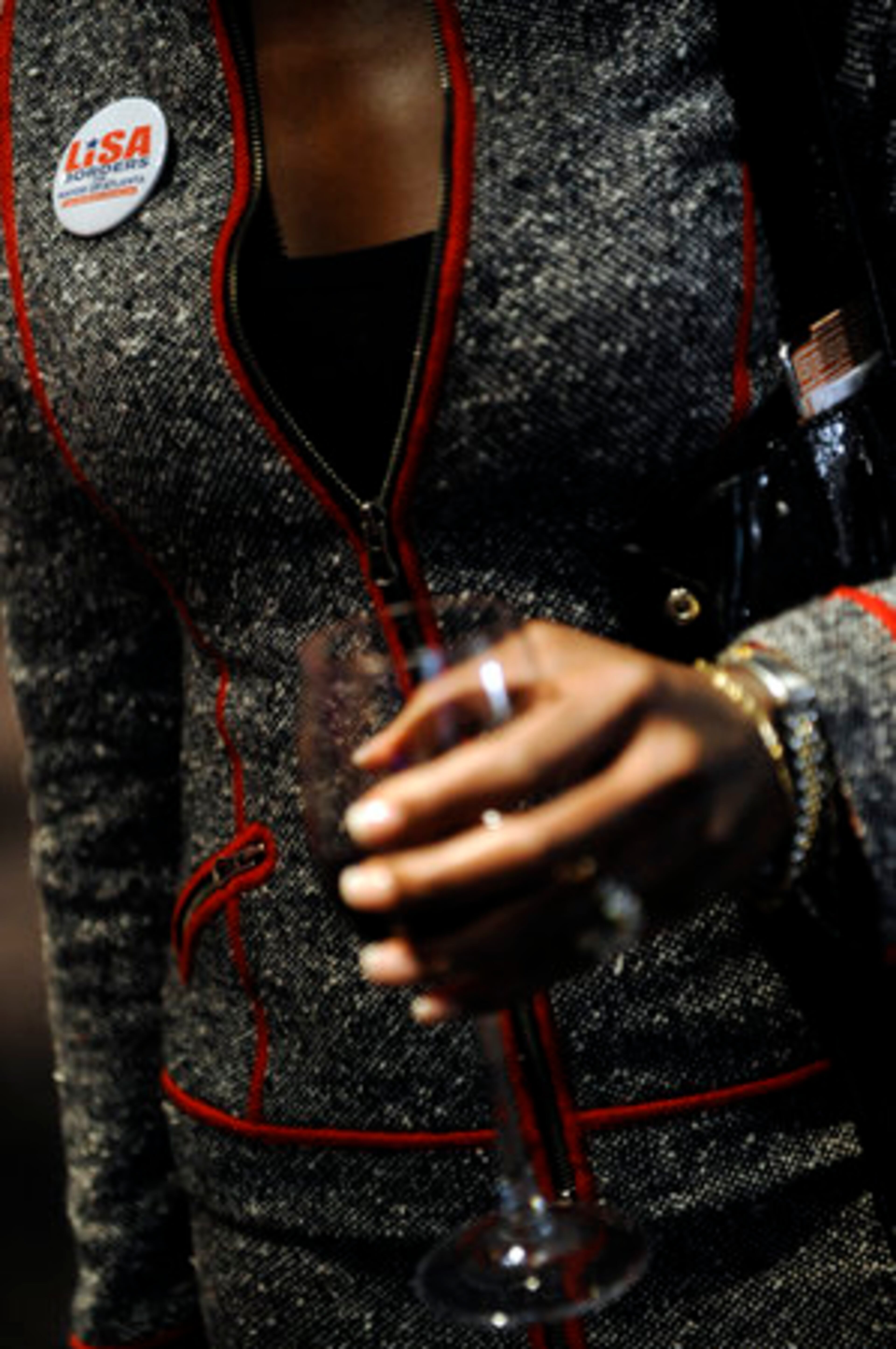 Danita Knight, chair of the Women's Committee for the Lisa Borders campaign, enjoys a glass of wine.