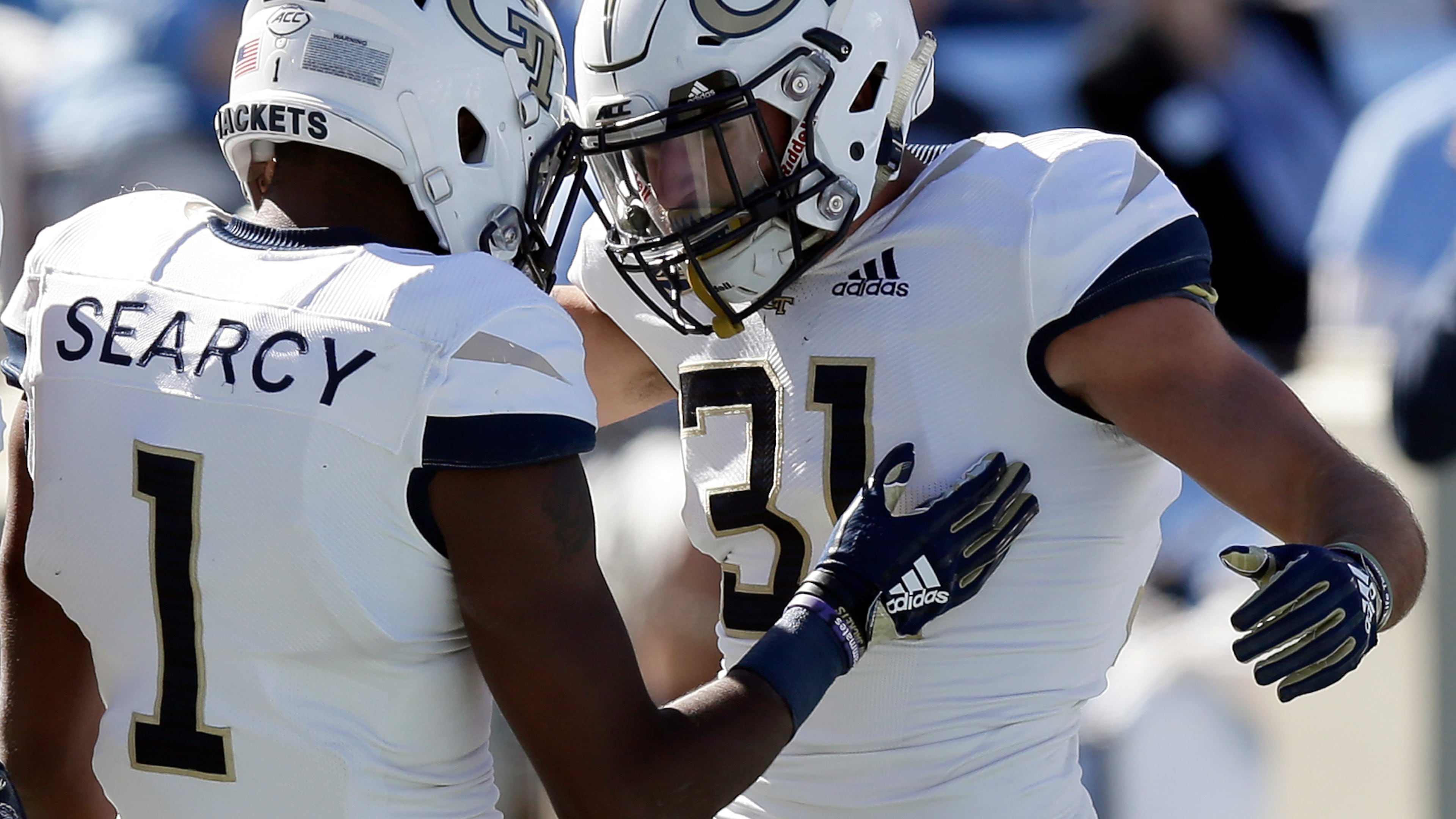Georgia Tech's Qua Searcy (1) congratulates Nathan Cottrell (31) following Cottrell's touchdown against North Carolina during the first half of an NCAA college football game in Chapel Hill, N.C., Saturday, Nov. 3, 2018. (AP Photo/Gerry Broome)
