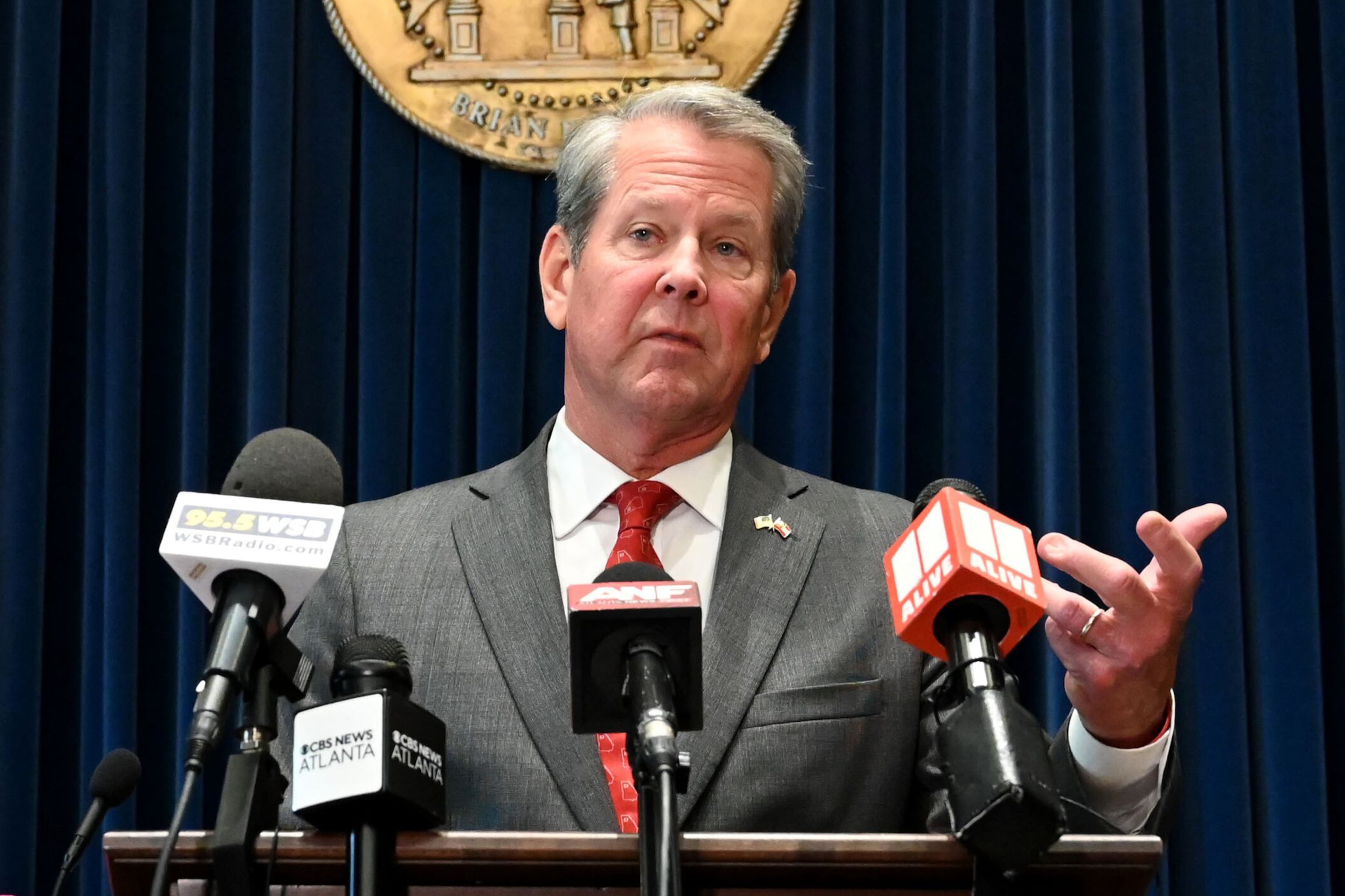 Gov. Brian Kemp speaks before signing the state’s new budget at the Georgia State Capitol on Tuesday, May 12, 2026, in Atlanta. Gov. Brian Kemp on Tuesday signed the state’s new budget – but not without deleting about $300 million of spending approved by the General Assembly just last month. (Hyosub Shin/AJC)