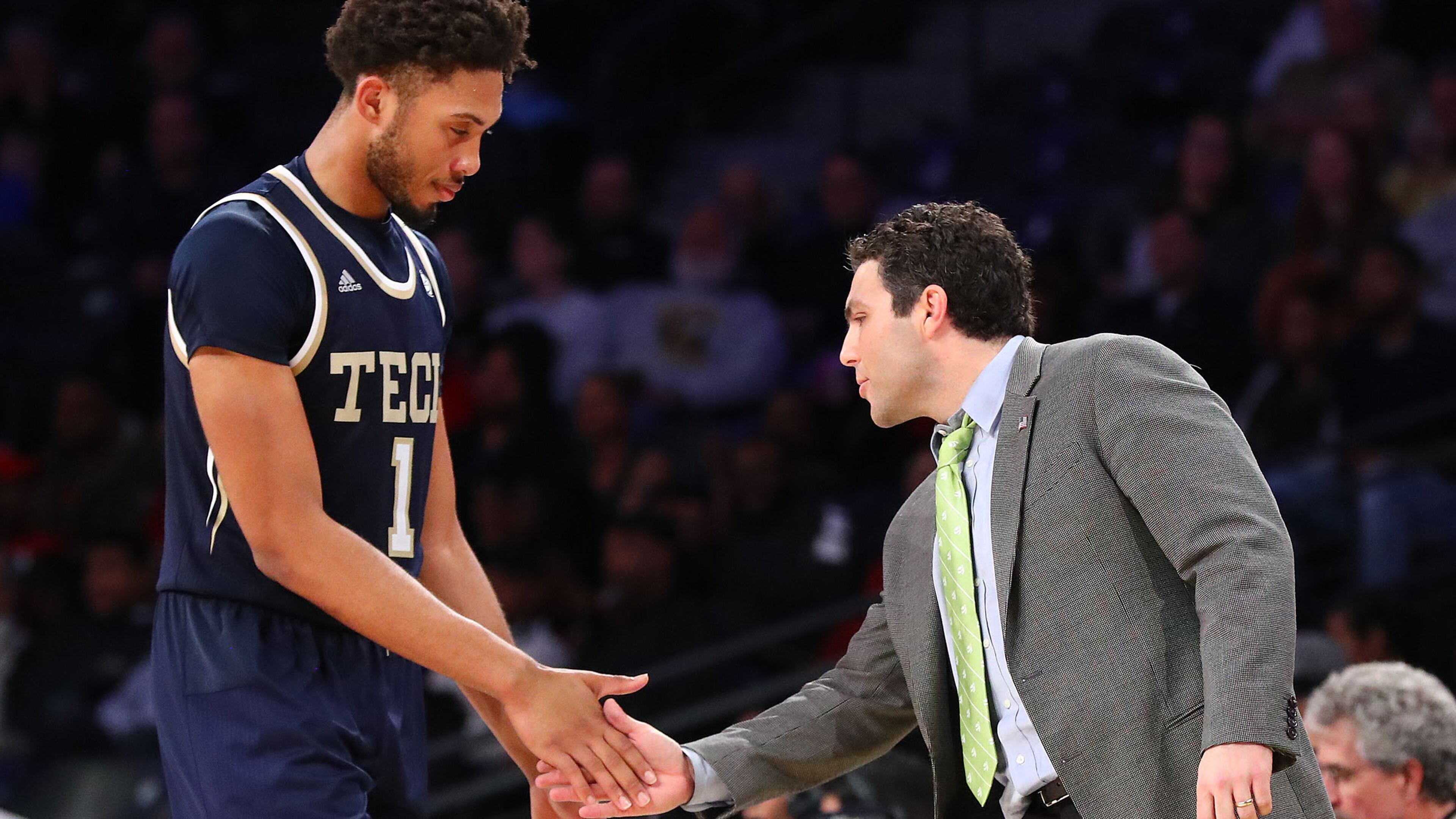 Georgia Tech head coach Josh Pastner gives forward James Banks III five during Tech's 81-78 overtime victory over Boston College Sunday, March 3, 2019, in Atlanta.