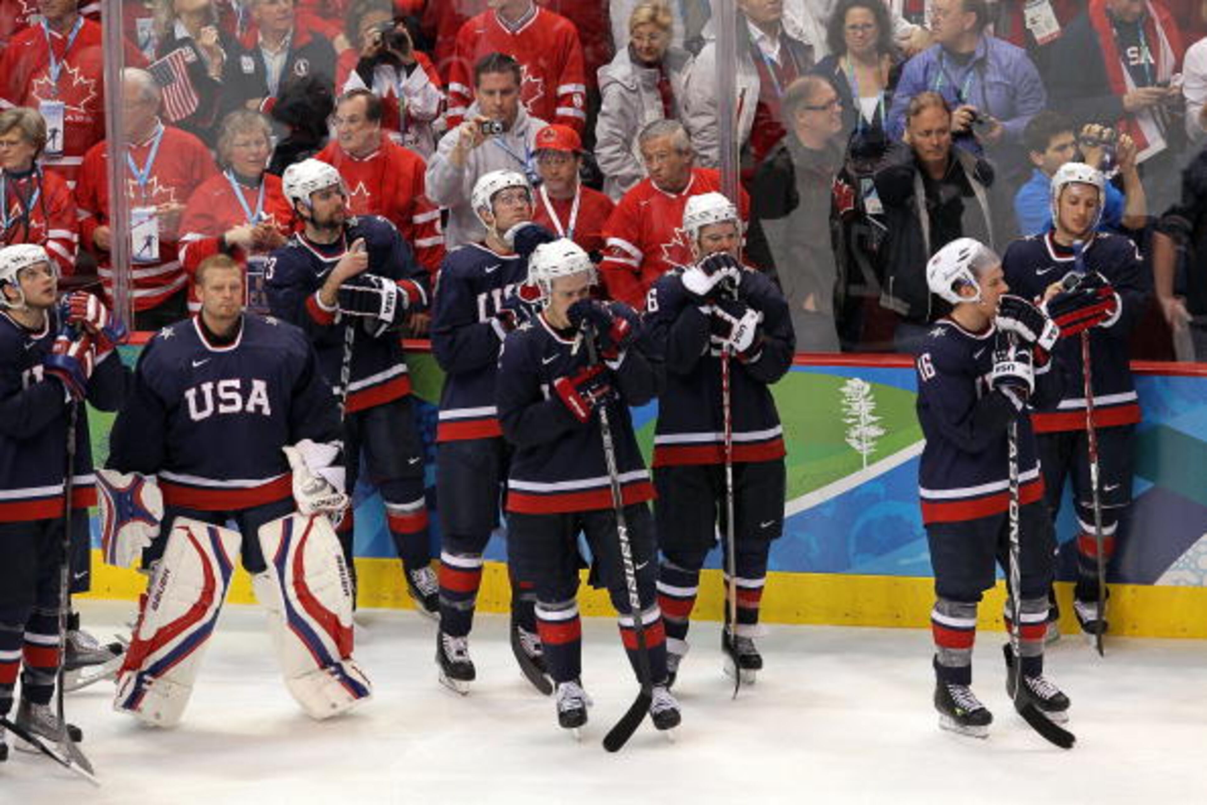 VANCOUVER, BC - FEBRUARY 28: (L-R) Bobby Ryan #54, goaltender Tim Thomas #30, Chris Drury #23, David Backes #47, Dustin Brown #32, Paul Stastny #26, Joe Pavelski #16 and Ryan Callahan #24 of USA look on dejectedly after Sidney Crosby #87 of Canada (not in photo) scored the match-winning goal in overtime in the ice hockey men's gold medal game between USA and Canada on day 17 of the Vancouver 2010 Winter Olympics at Canada Hockey Place on February 28, 2010 in Vancouver, Canada. Canada defeated USA 3-2 in overtime. (Photo by Jamie Squire/Getty Images)