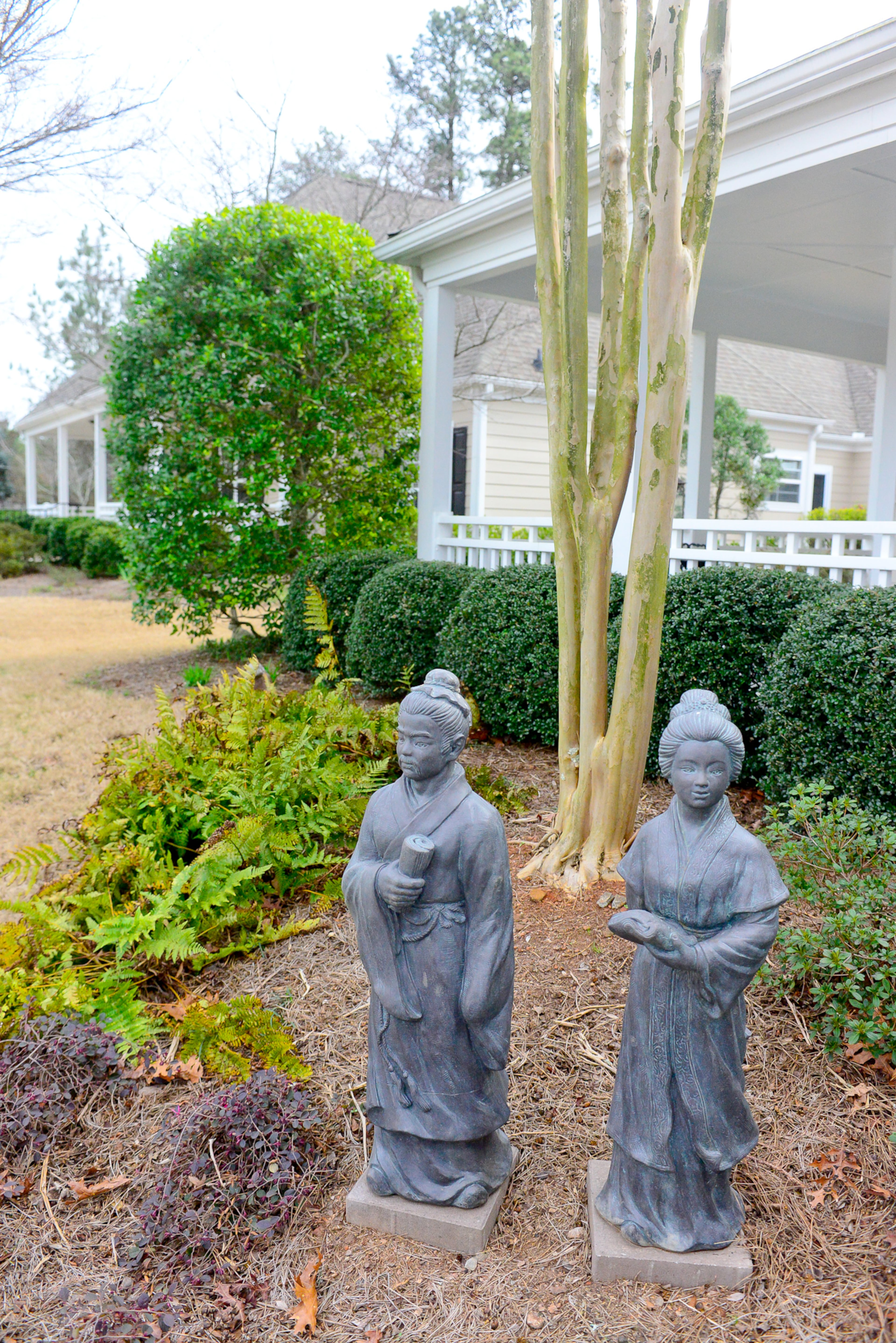 Touches of Asian style can be found inside and outside. In the front garden, visitors are welcomed by a set of Asian-inspired statues from Four Seasons Pottery in Sandy Springs.