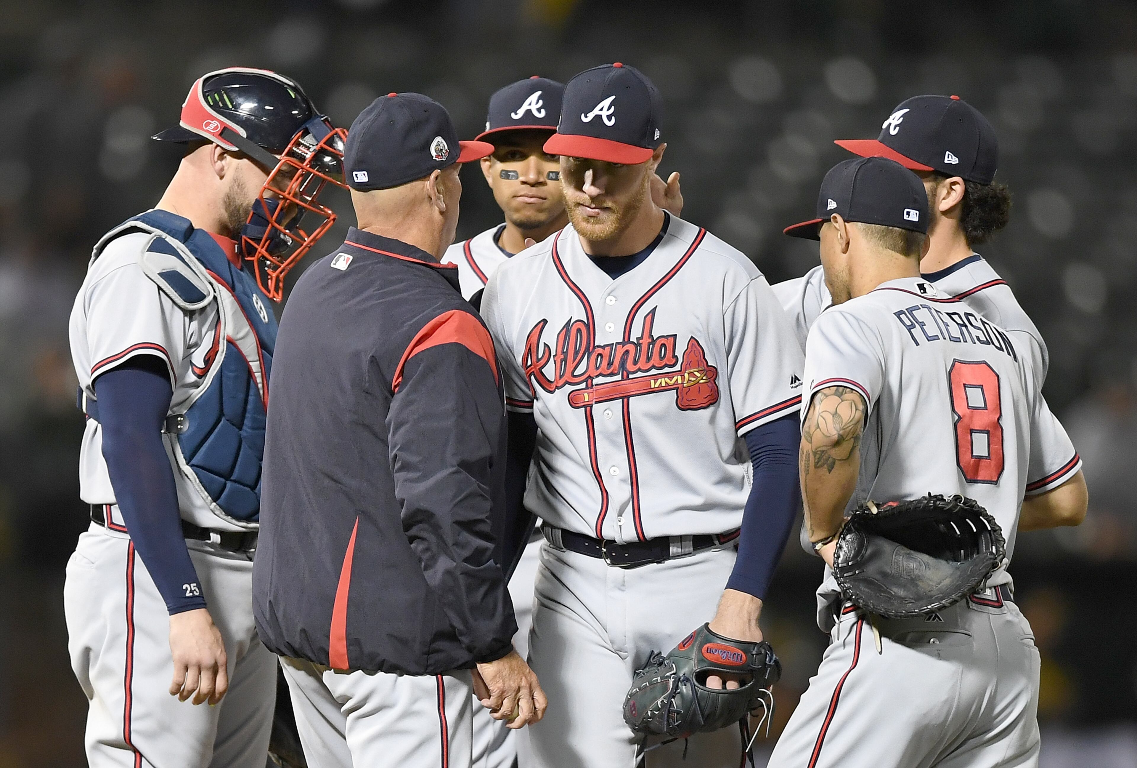 OAKLAND, CA - JUNE 30: Manager Brian Snitker #43 of the Atlanta Braves takes the ball from starting pitcher Mike Foltynewicz #26 taking Foltynewicz out of the game against the Oakland Athletics in the bottom of the ninth inning at Oakland Alameda Coliseum on June 30, 2017 in Oakland, California. (Photo by Thearon W. Henderson/Getty Images)