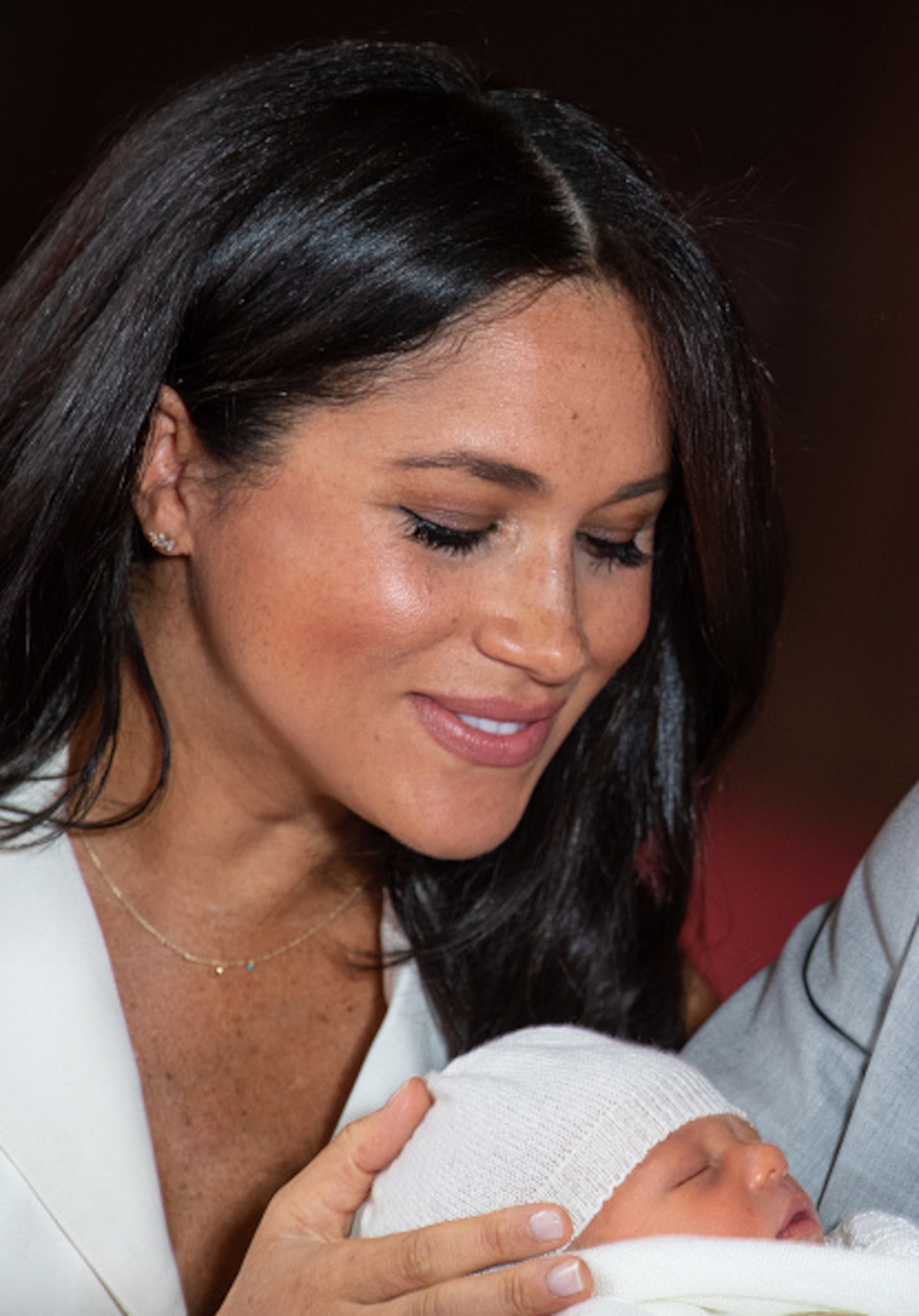 Prince Harry, Duke of Sussex and Meghan, Duchess of Sussex, pose with their newborn son during a photocall in St George's Hall at Windsor Castle on May 8, 2019 in Windsor, England. The Duchess of Sussex gave birth at 05:26 on Monday 06 May, 2019.