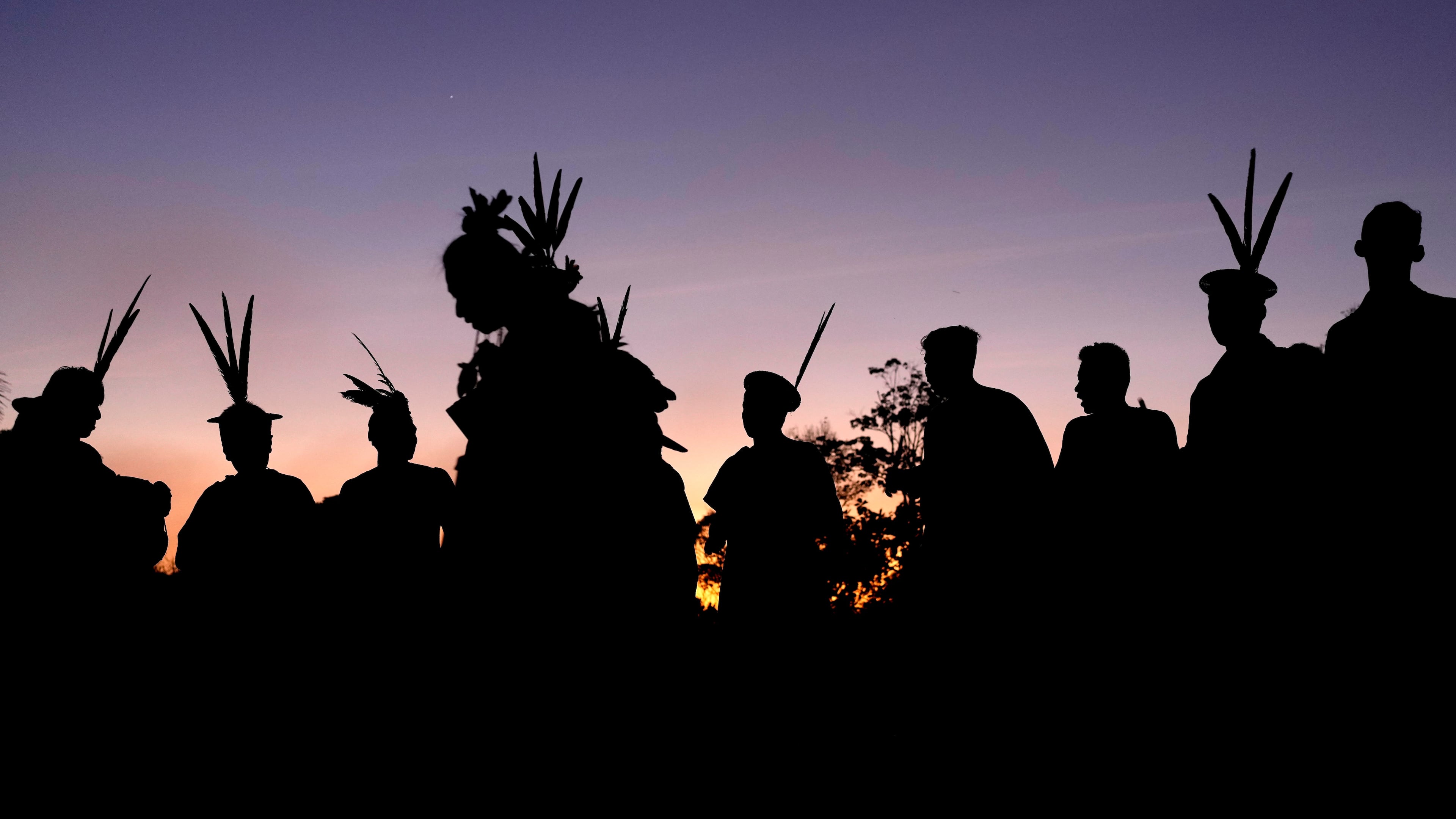 FILE - Ashaninka Indigenous people from Brazil and Peru dance and sing at dawn during the annual celebration recognizing the Ashaninka territory in the Apiwtxa village, Acre state, Brazil, June 24, 2024. (AP Photo/Jorge Saenz, File)