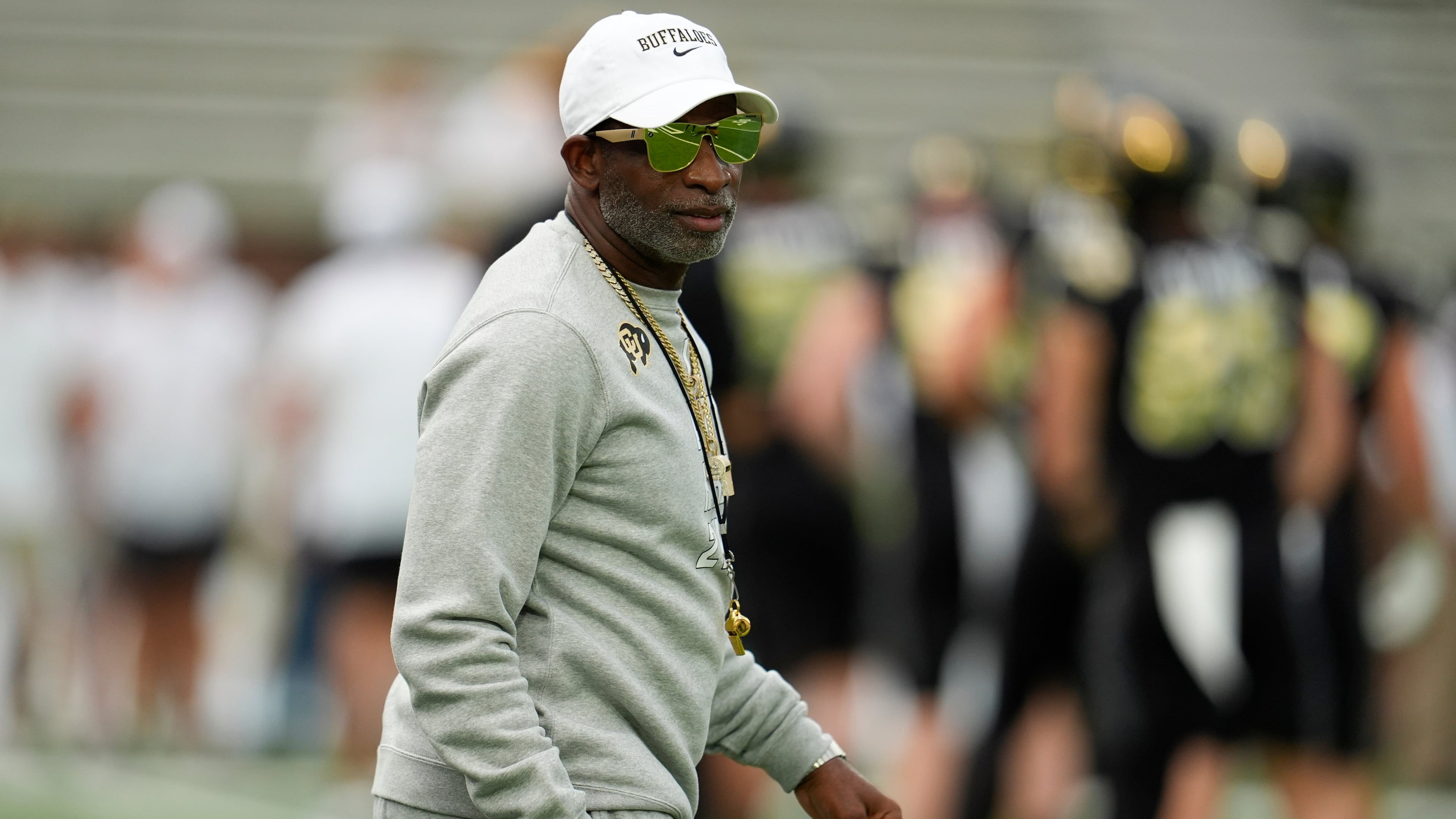 Colorado head coach Deion Sanders walks on the field before an NCAA college football game between Georgia Tech and Colorado, Thursday, Sept. 3, 2026, in Atlanta. (AP Photo/Mike Stewart)