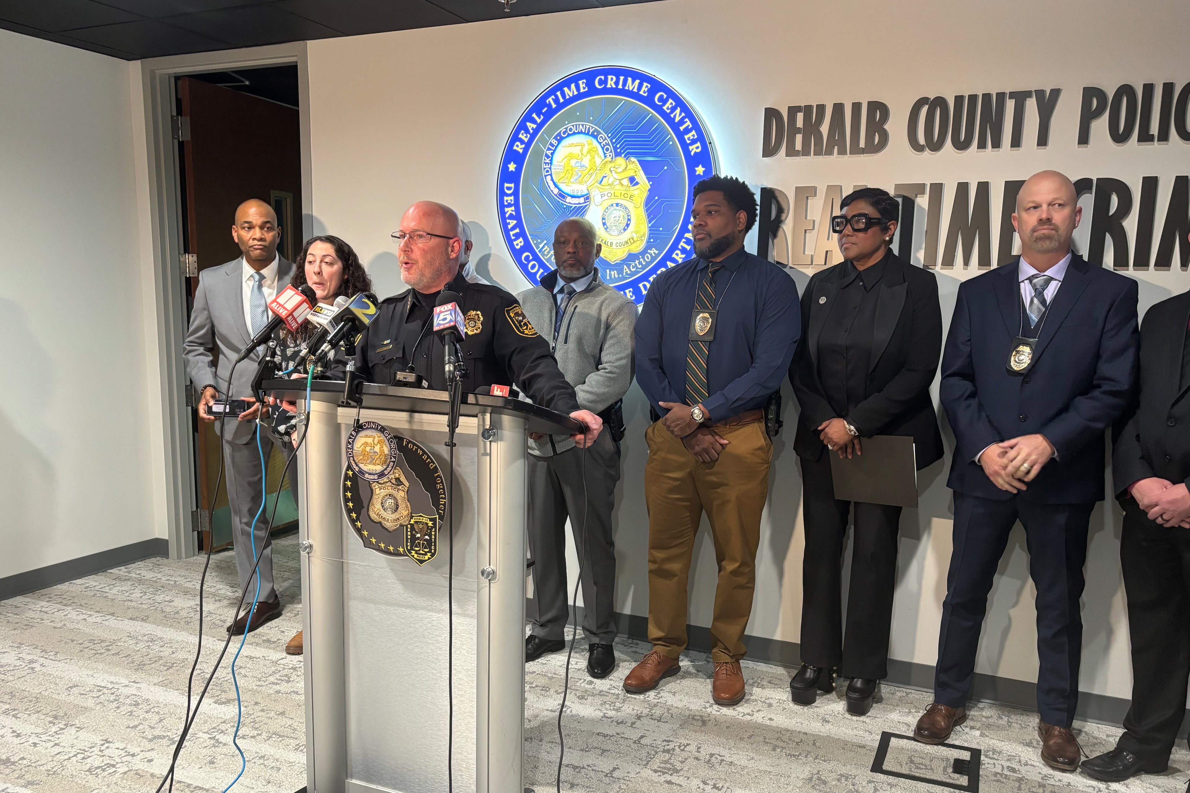 DeKalb County police Chief Greg Padrick (at lectern) spoke during a news conference Monday about the shooting of a 3-year-old boy over the weekend. (David Aaro/AJC)