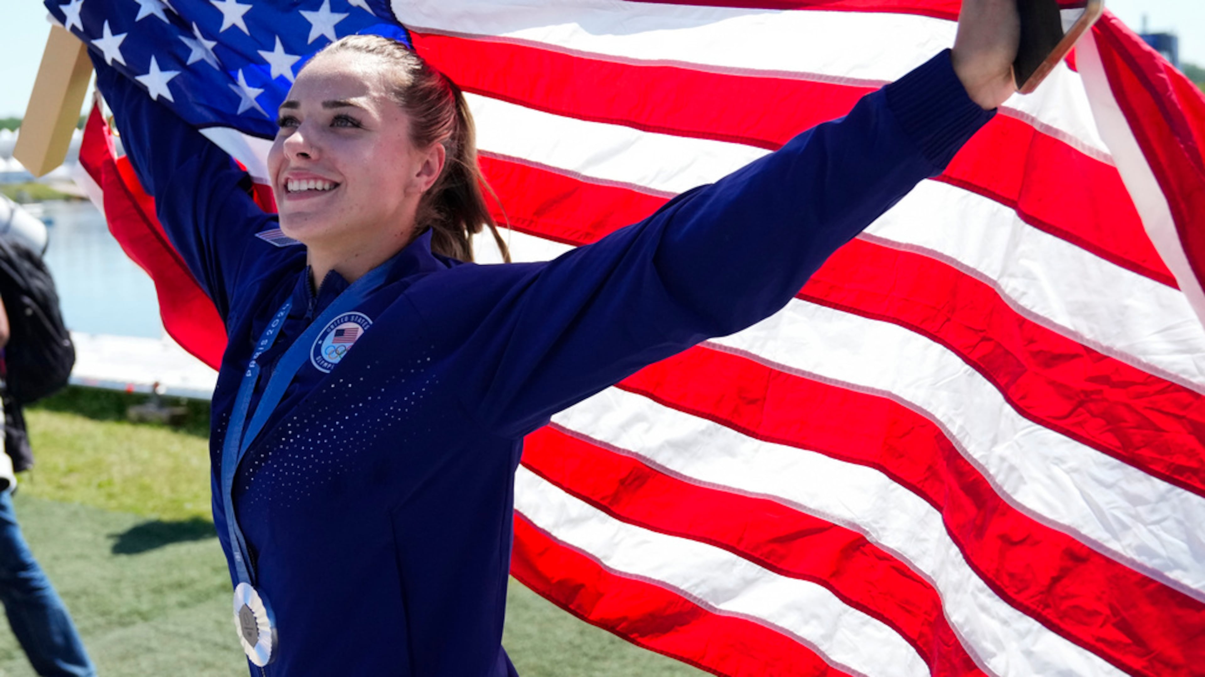Nevin Harrison, of the United States, celebrates with the silver medal for the women's canoe single 200-meter finals at the 2024 Summer Olympics, Saturday, Aug. 10, 2024, in Vaires-sur-Marne, France. (AP Photo/Ebrahim Noroozi)