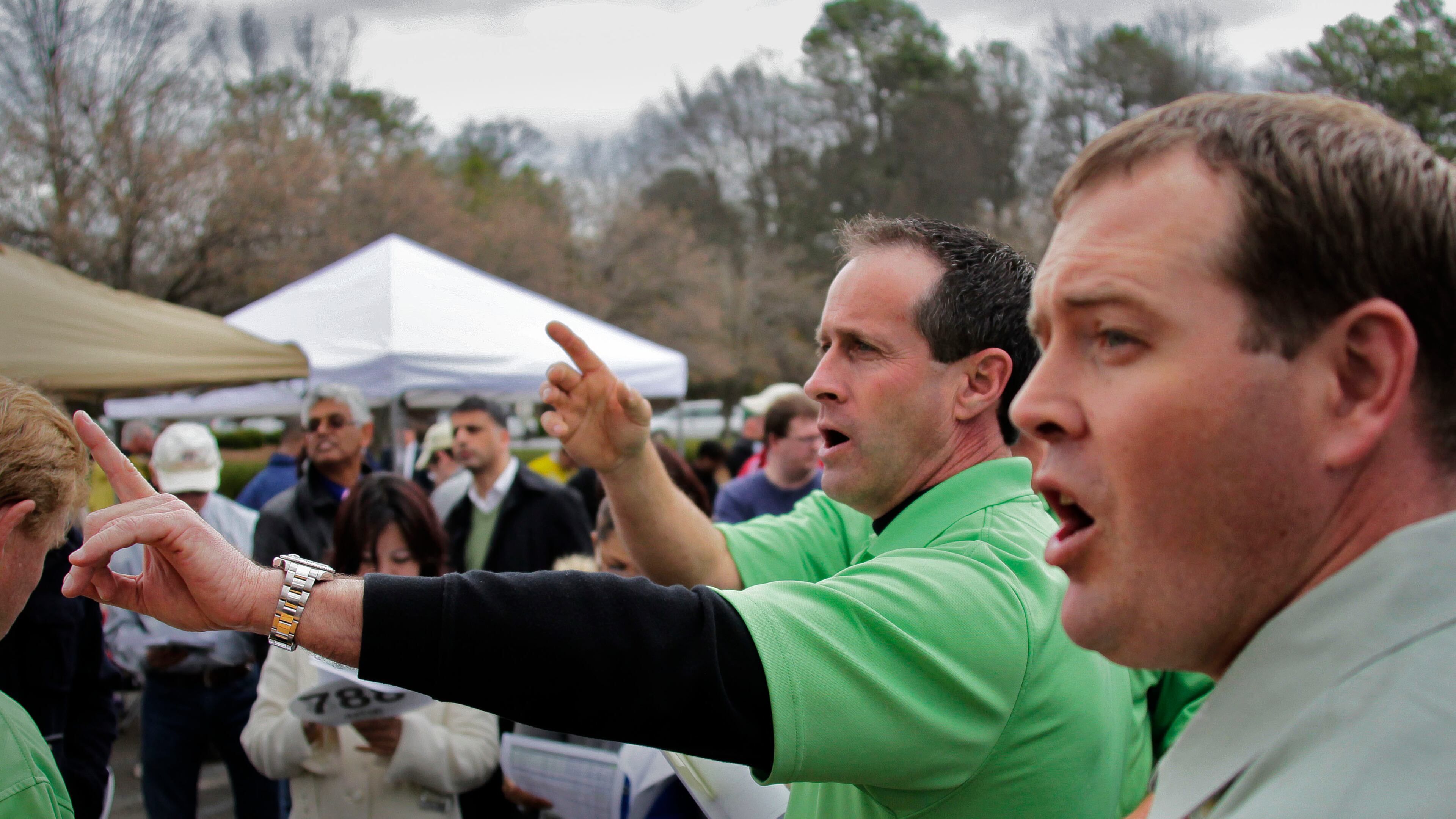 Auctioneers Tom Zeller (right) and Marshall McAbee elicit bids at a 2013 foreclosure auction in Gwinnett County. Photo by Bob Andres, AJC