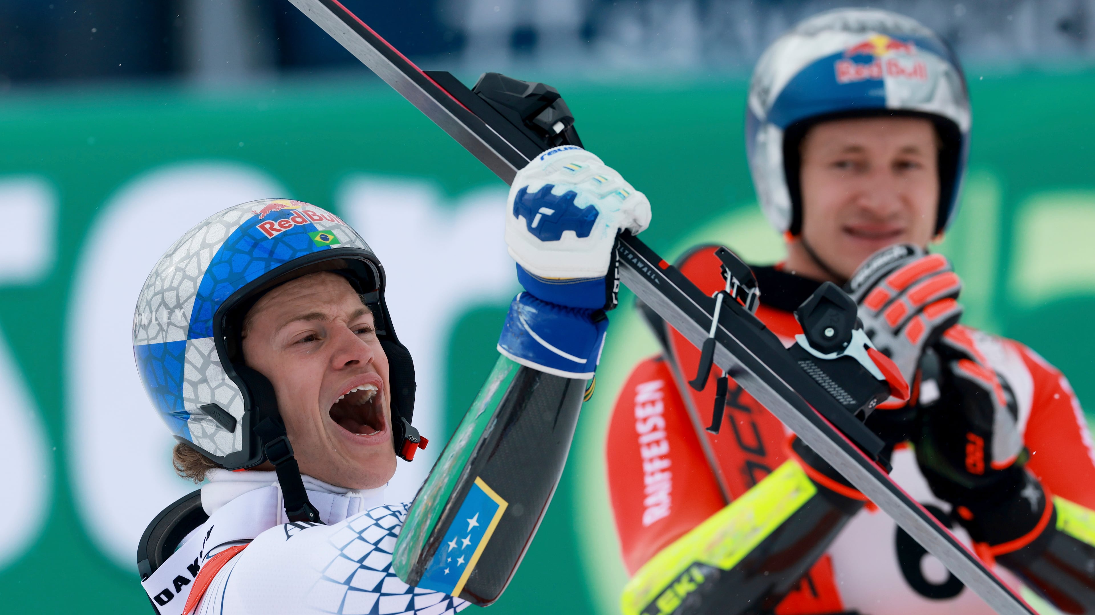 Brazil's Lucas Pinheiro Braathen celebrates winning an alpine ski, men's World Cup giant slalom as third-placed Switzerland's Marco Odermatt applauds in the background, in Soelden, Austria, Sunday, Oct. 25, 2026. (AP Photo/Alessandro Trovati)