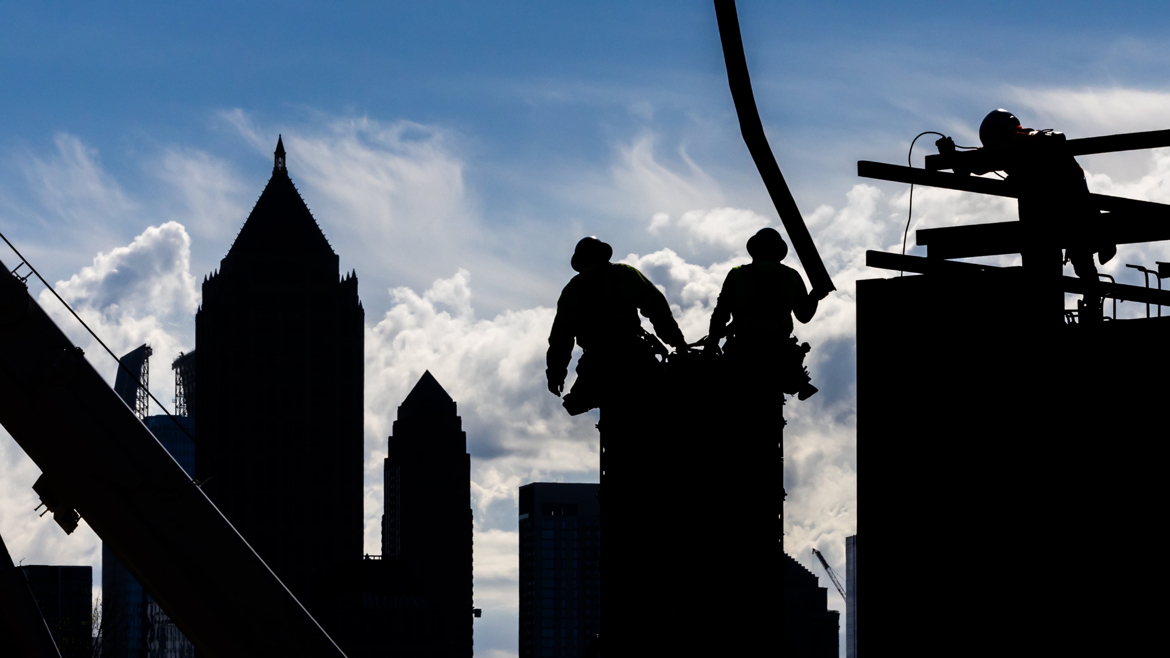 Construction workers pour concrete into forms along Bishop Street near 17th Street in West Midtown Atlanta in 2024 as they work on a mixed-use project called UrbA ATL. Much has changed over the past 30 years in Atlanta, both the city and the region, in terms of size, diversity, and population. (John Spink/AJC 2024)