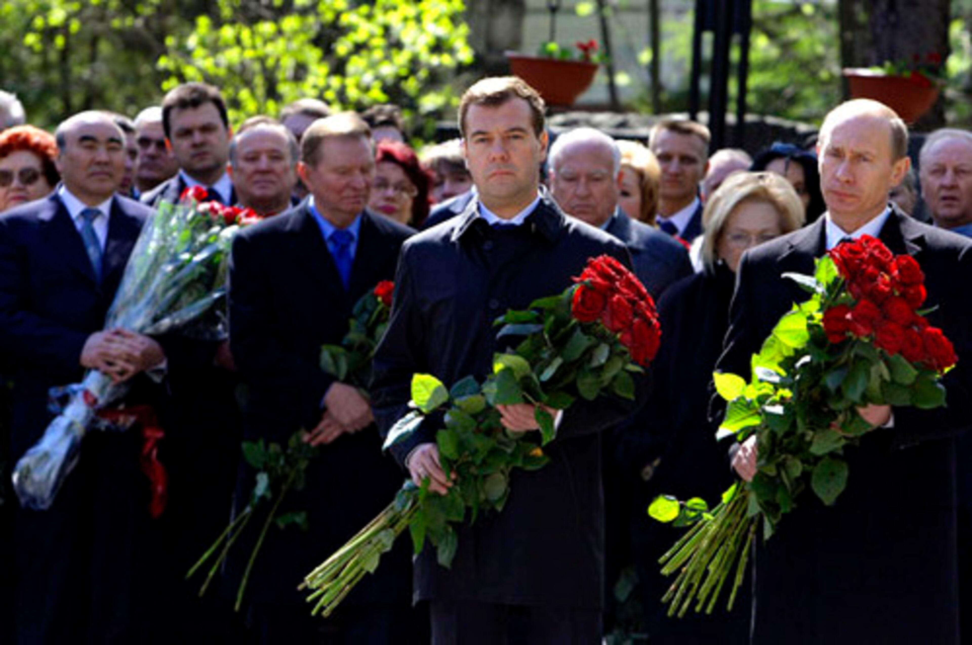 Russian President Vladimir Putin, right, and president-elect Dmitry Medvedev, center, bring flowers to the unveiling of a monument to first Russian president Boris Yeltsin in Moscow on Wednesday. Hundreds of the country's political elite gathered at Novodevicheye cemetery to pay their respects to Yeltsin on the first anniversary of his death.