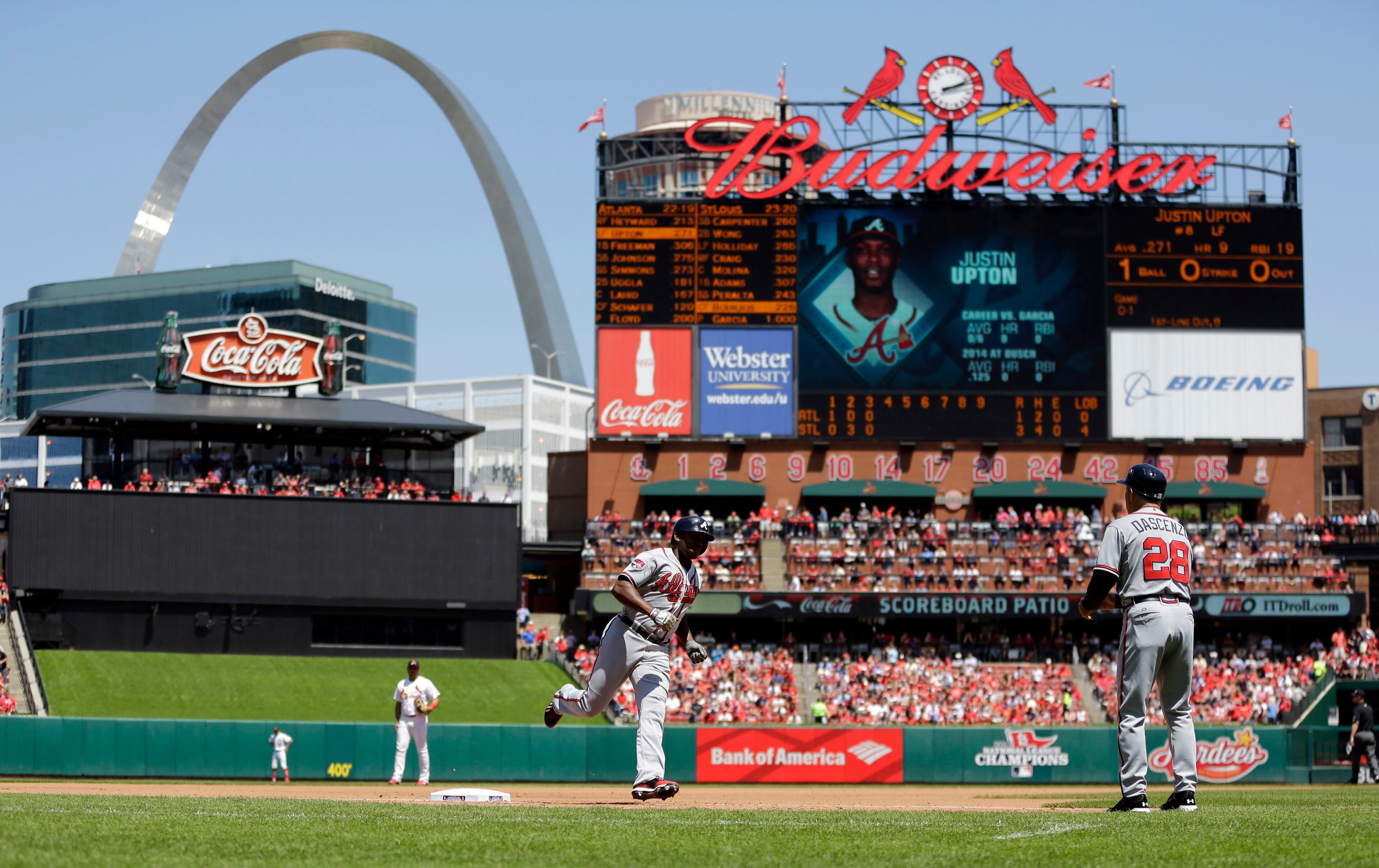 Atlanta Braves' Justin Upton rounds third and heads for home after hitting a solo home run during the fourth inning of a baseball game against the St. Louis Cardinals Sunday, May 18, 2014, in St. Louis. The Braves won 6-5. (AP Photo/Jeff Roberson)