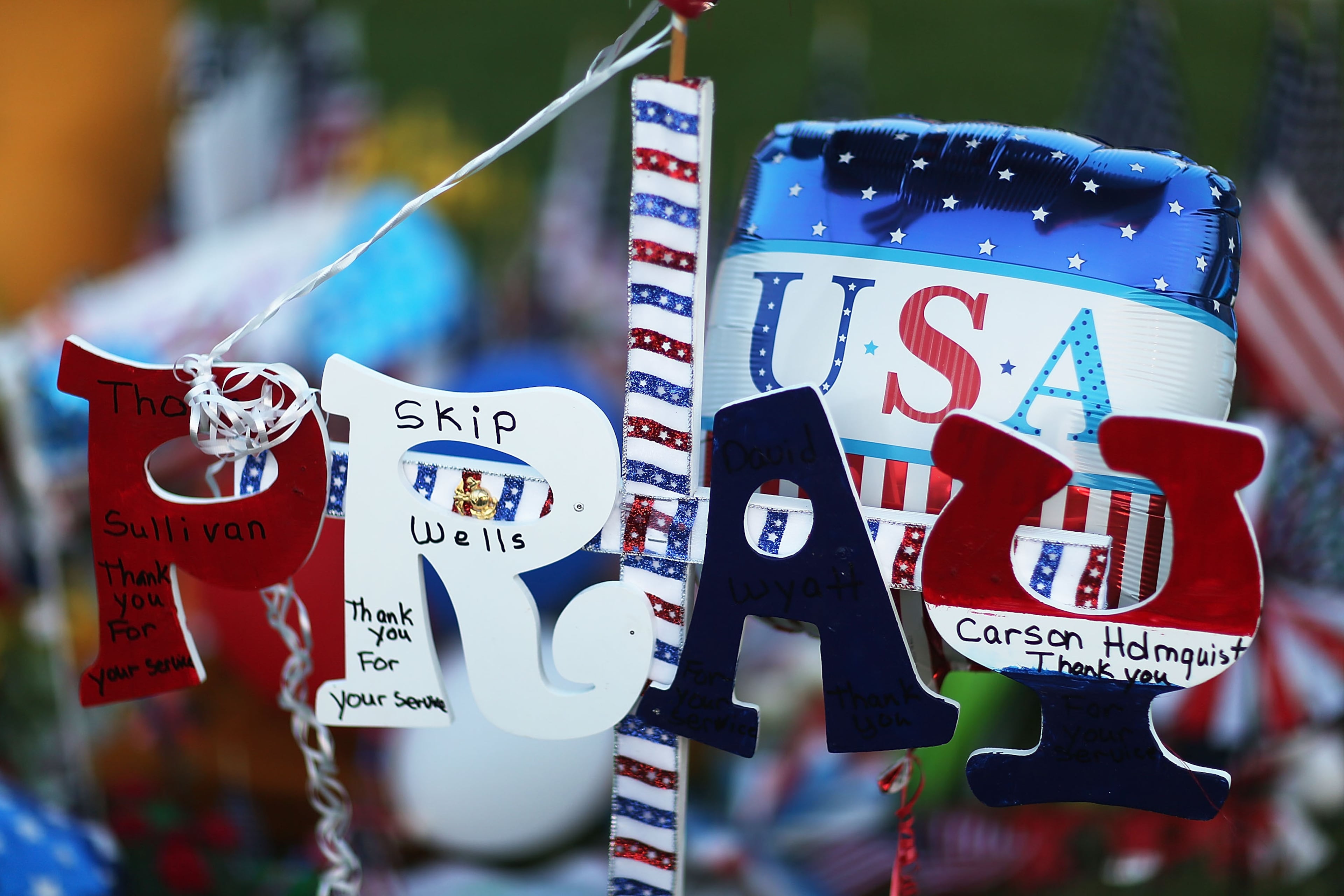 CHATTANOOGA, TN - JULY 18: A sign is seen among the memorial setup in front of the Armed Forces Career Center/National Guard Recruitment Office on July 18, 2015 in Chattanooga, Tennessee. According to reports, Mohammod Youssuf Abdulazeez, 24, opened fire on the military recruiting station on July 16th at the strip mall and then drove to an operational support center operated by the U.S. Navy and killed four United States Marines there, more than seven miles away, (Photo by Joe Raedle/Getty Images)
