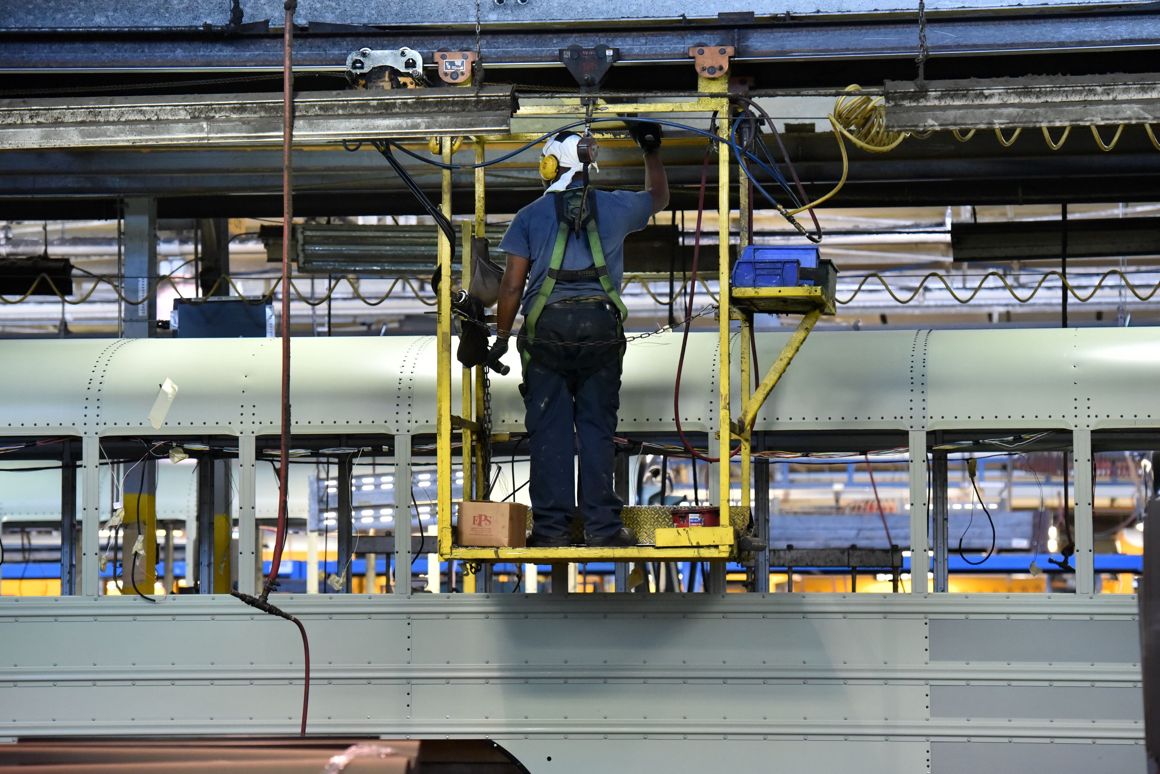 December 1, 2016 Fort Valley - Blue Bird Corporation workers work on the school bus assembly line at the company's headquarters in Fort Valley on Tuesday, December 21, 2016. Blue Bird Corporation is one of those venerable, rural manufacturers that produces the kind of jobs that Trump's core supporters are expecting him to produce. It has been through the wringer, but seems to be on the rise now -- good news for its little home town of Fort Valley. HYOSUB SHIN / HSHIN@AJC.COM