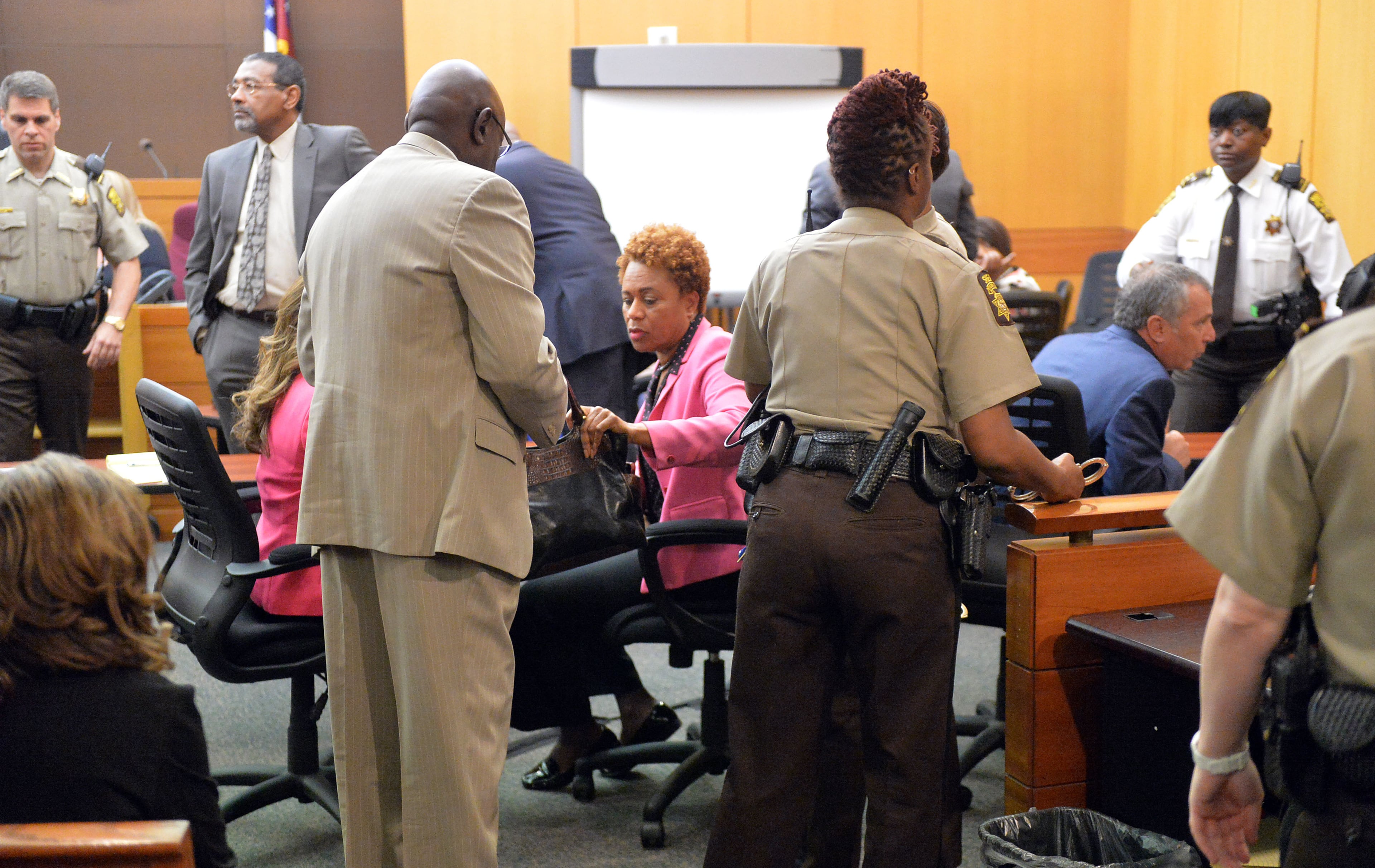 Former APS SRT Director Sharon Davis Williams gathers her items before she is handcuffed and led to a detention cell following her conviction on Violation of Racketeer Influenced and Corrupt Organizations Act charges. A jury of six men and six women render convicted 11 of 12 defendants on RICO and other assorted charges on their eighth day of deliberations in the Atlanta Public Schools test-cheating trial on Wednesday, April 1, 2015. Jurors sorted through roughly five months of testimony against 12 former educators accused of engaging in a racketeering conspiracy to inflate test scores. (Atlanta Journal-Constitution, Kent D. Johnson, Pool)