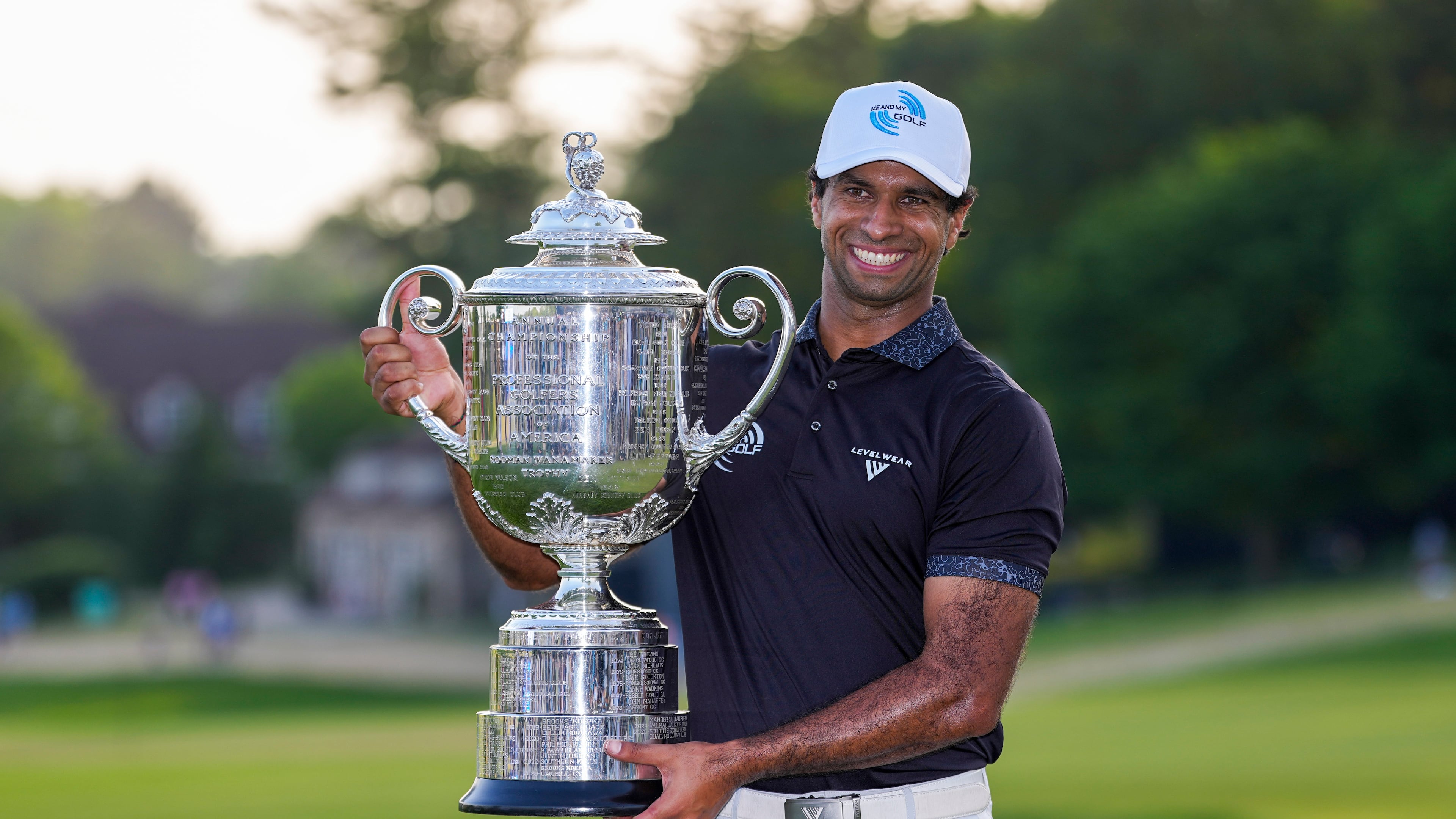 Aaron Rai, of England, holds the Wanamaker Trophy after winning the PGA Championship golf tournament at Aronimink Golf Club, Sunday, May 17, 2026, in Newtown Square, PA. (AP Photo/Matt Slocum)
