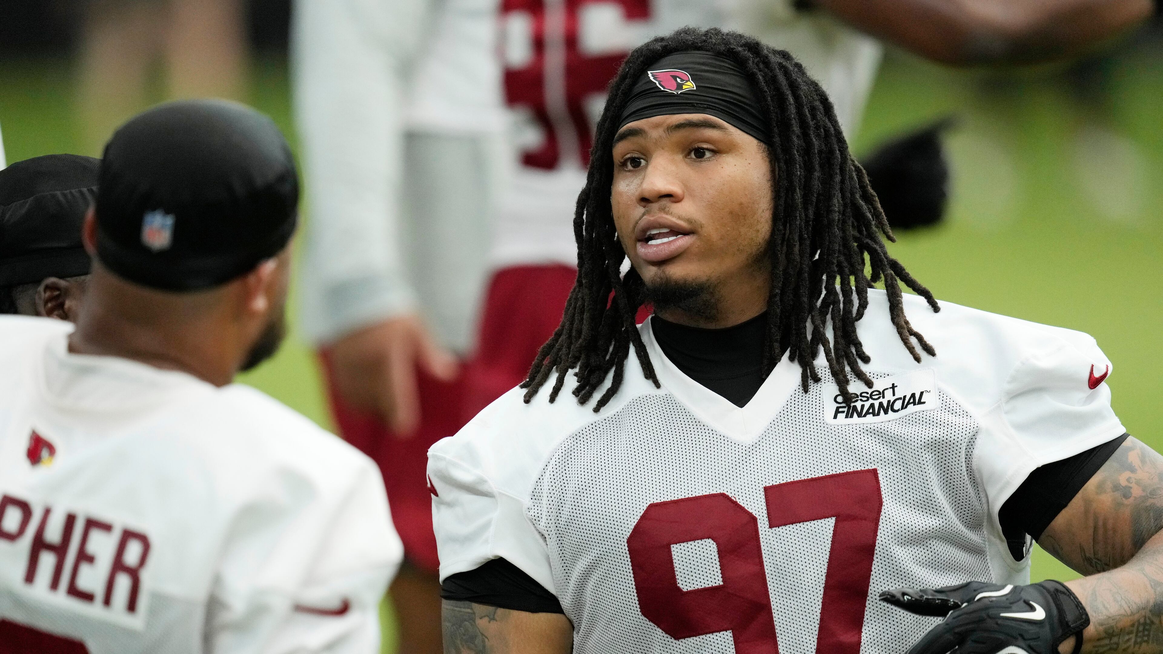 Arizona Cardinals defensive tackle Walter Nolen III (97) talks with Cardinals defensive tackle PJ Mustipher during NFL football training camp, Sunday, July 26, 2026, in Glendale, Ariz. (AP Photo/Ross D. Franklin)