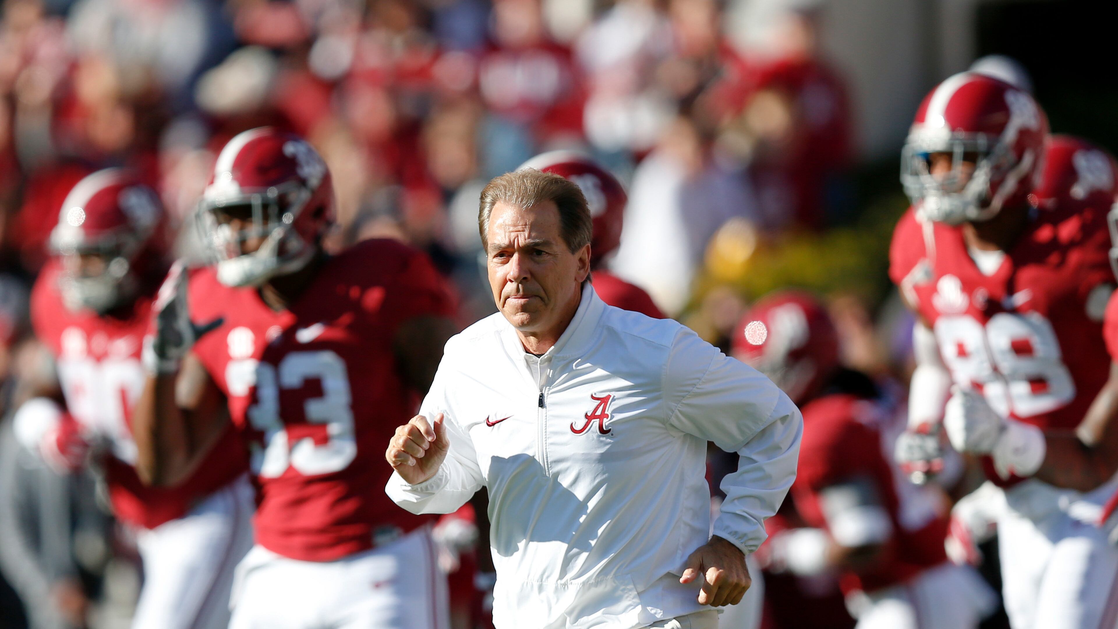 Alabama head coach Nick Saban runs onto the field before the Iron Bowl game against Auburn last Saturday. (AP photo)