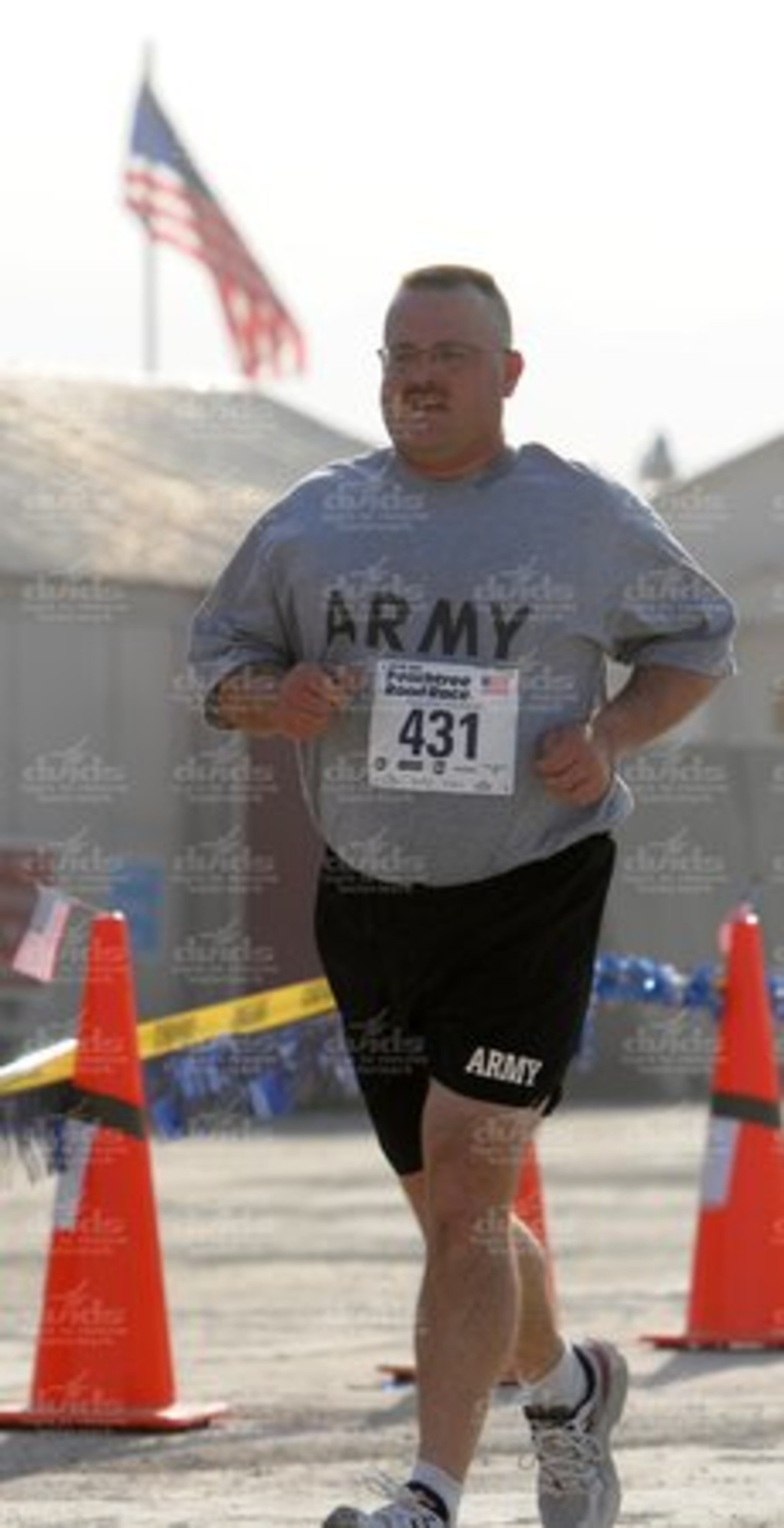 Master Sgt. Richard Albertson, of the South Dakota Army National Guard, completes a lap during the Peachtree Road Race, Afghanistan division, July 4.