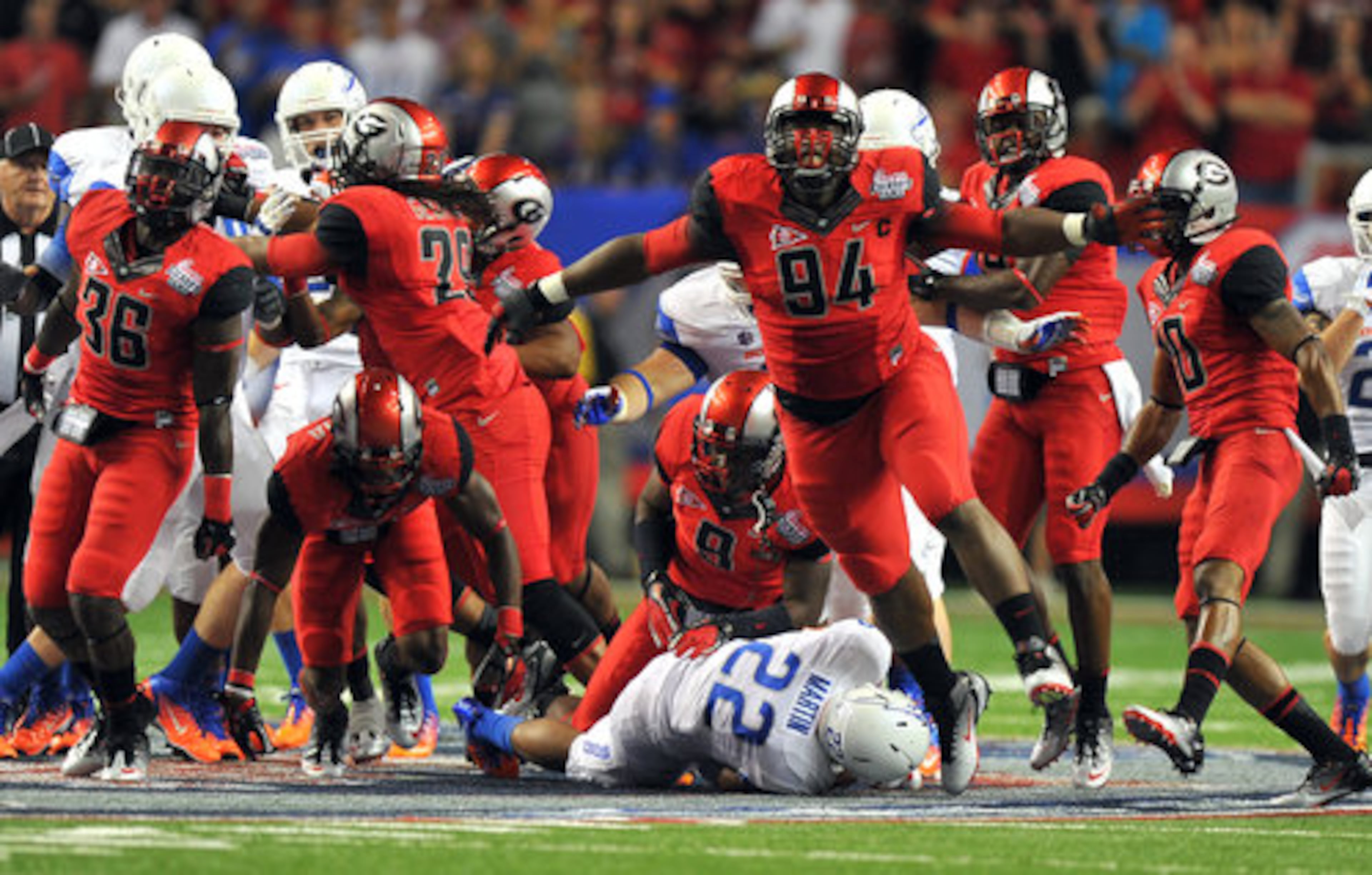 Georgia defensive lineman DeAngelo Tyson celebrates after stopping Boise State running back Doug Martin for a one yard gain.