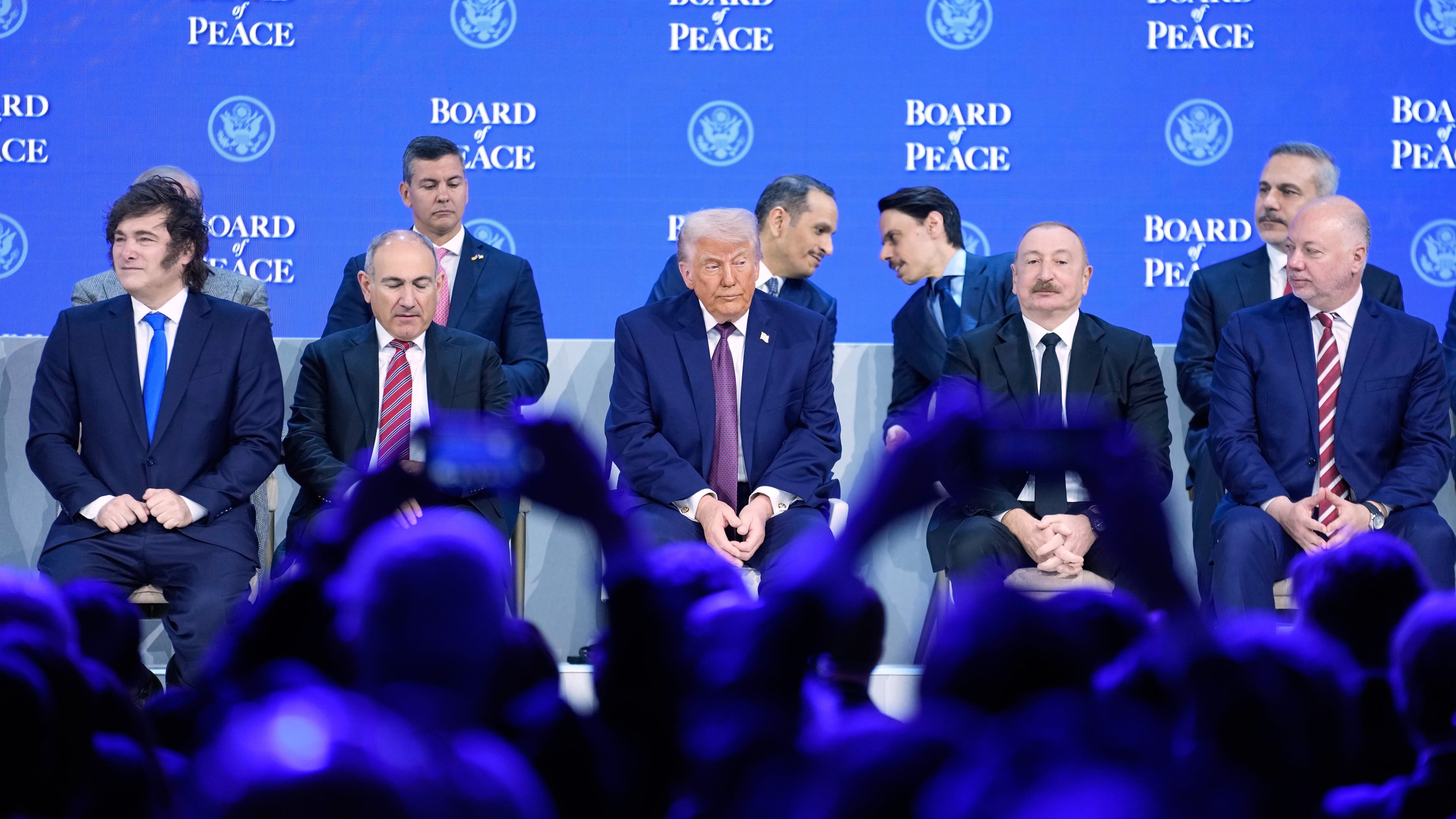 President Donald Trump sits on the podium during a session on the Board of Peace, his initiative, at the annual meeting of the World Economic Forum in Davos, Switzerland, Thursday, Jan. 22, 2026. (Markus Schreiber/AP)