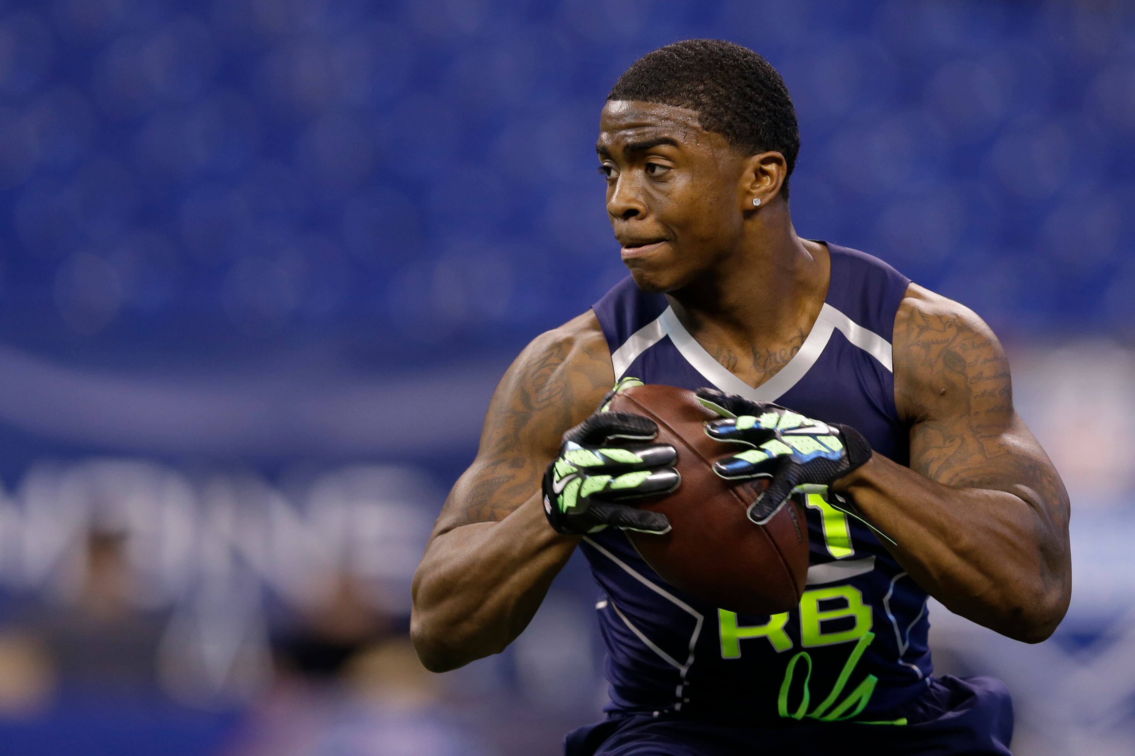Georgia Southern running back Jerick Mckinnon runs a drill at the NFL football scouting combine in Indianapolis, Sunday, Feb. 23, 2014. (AP Photo/Michael Conroy)