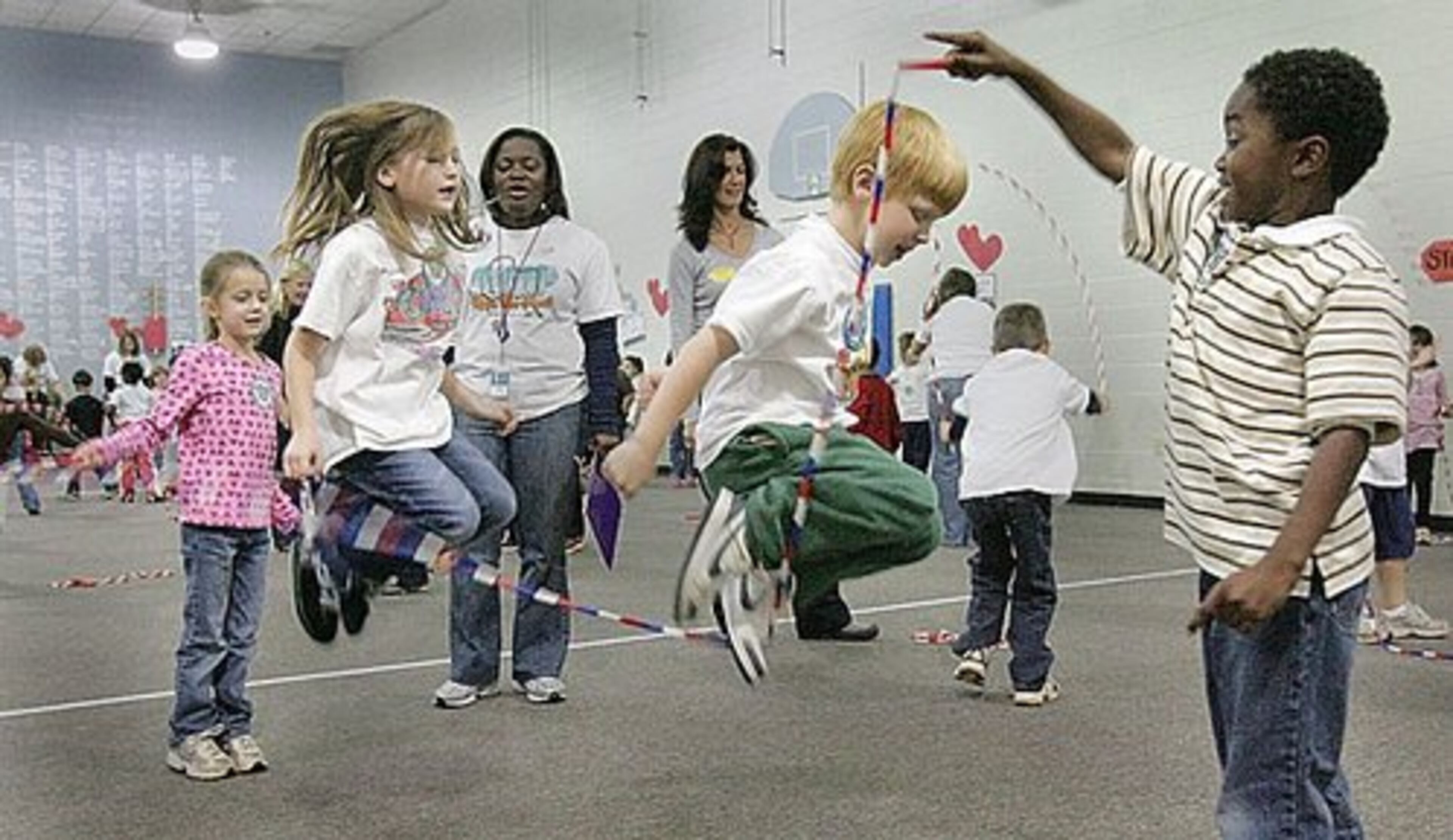 (Left to right) First-graders Gabriella Gilchrist, Jessica Skriba, Jacob Suttles, Freddy Woods all were taking turns jumping doubles.