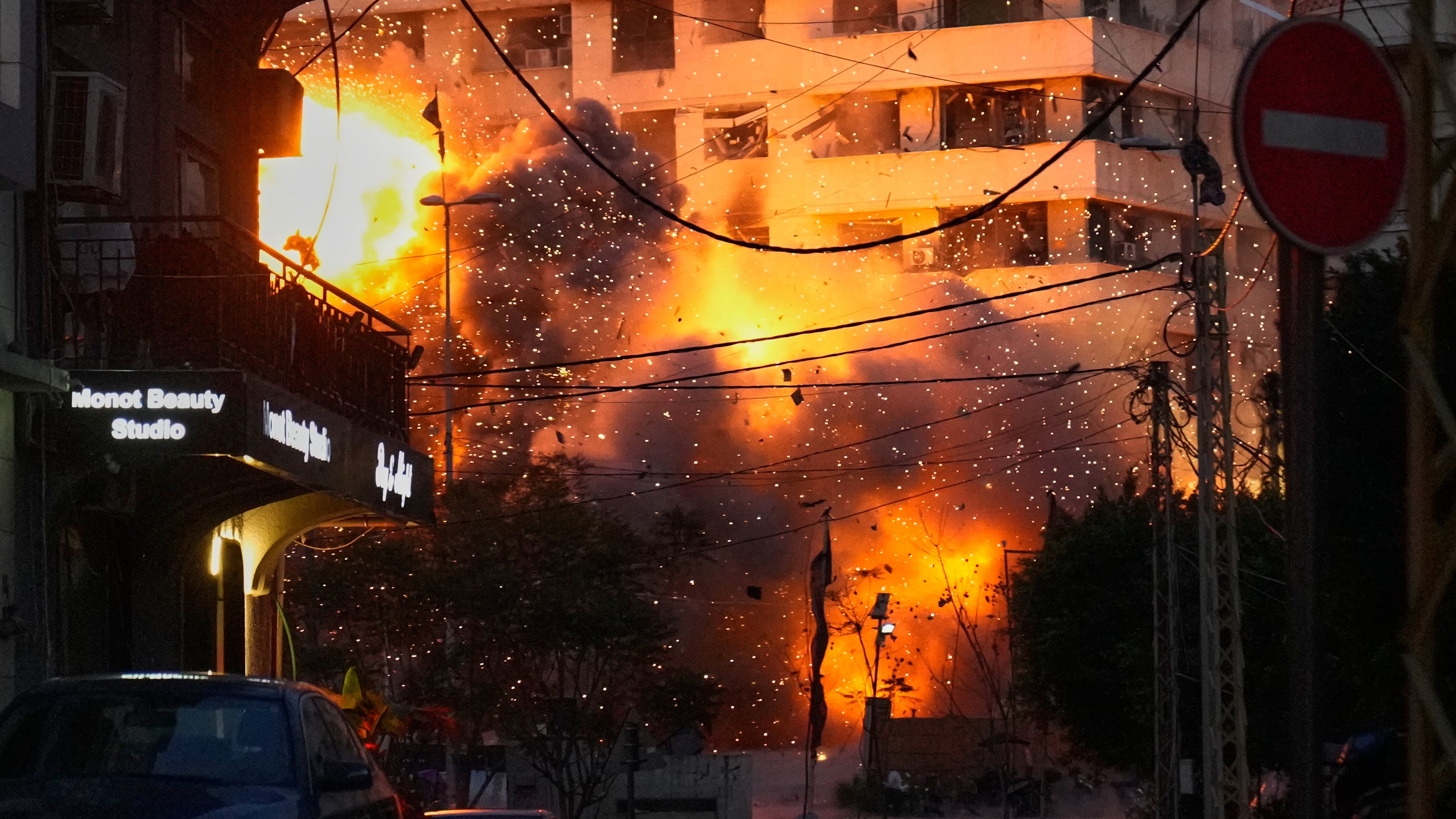 An explosion erupts from a building following an Israeli strike in central Beirut, Lebanon, Wednesday, March 18, 2026. (AP Photo/Hussein Malla)