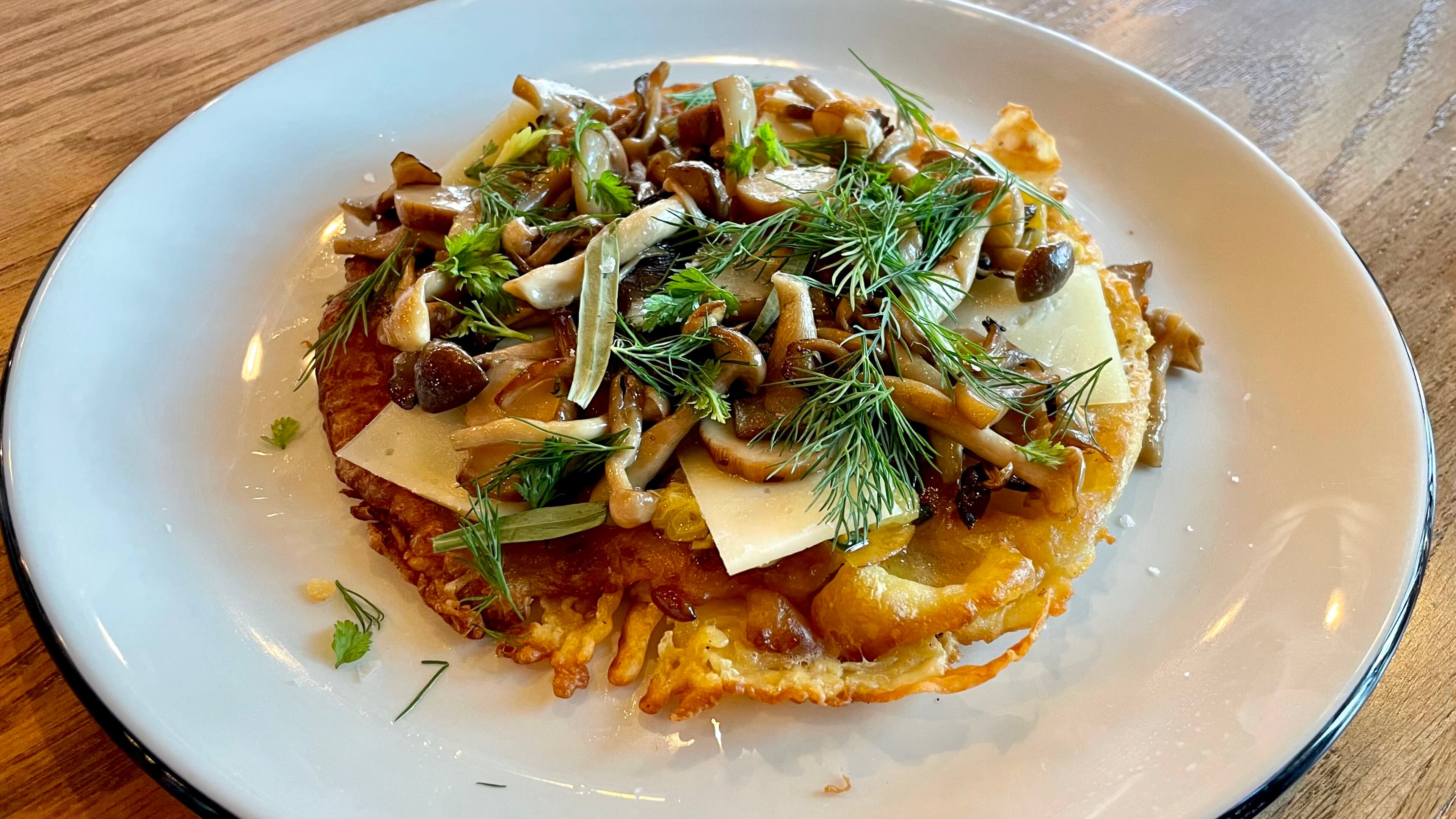 Alici's wild mushroom socca gives you a different taste combination in each bite. Angela Hansberger for The Atlanta Journal-Constitution