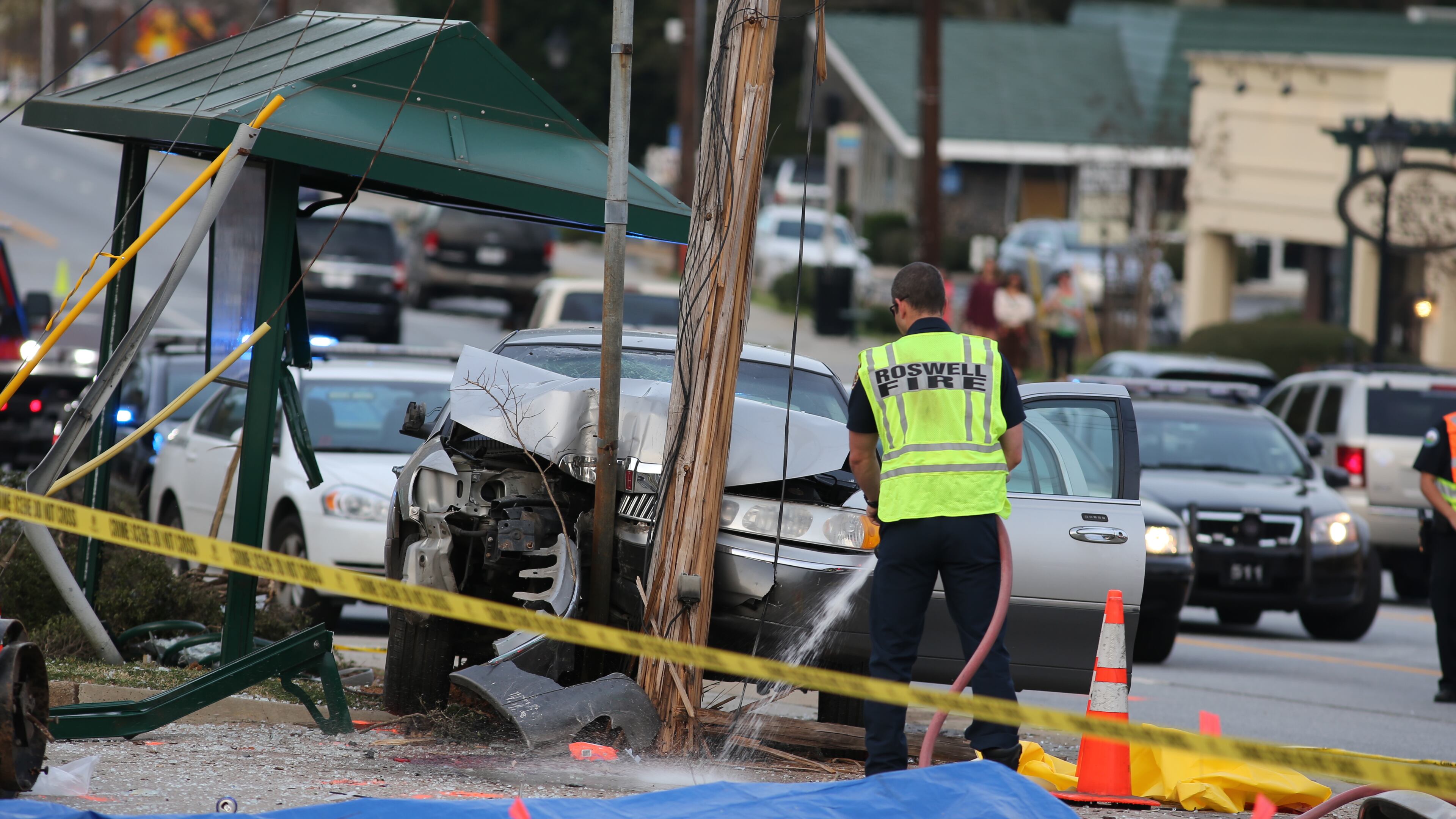 One person was killed and two more were injured Thursday when a driver went around a MARTA bus and struck people waiting at the bus stop (Photo by Ben Gray BGray@ajc.com).