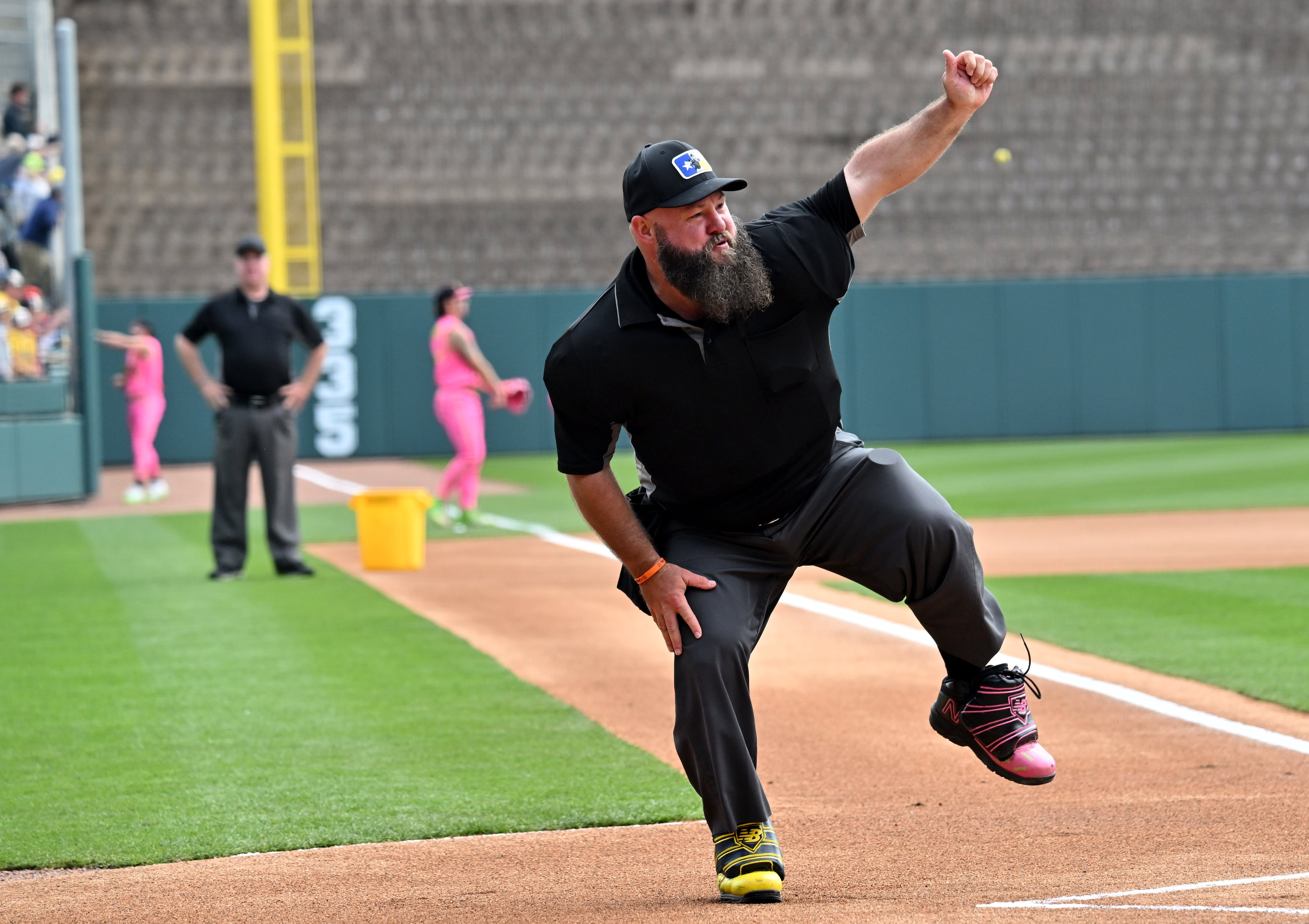 An umpire dances during pregame festivities at Coolray Field. (Hyosub Shin / Hyosub.Shin@ajc.com)