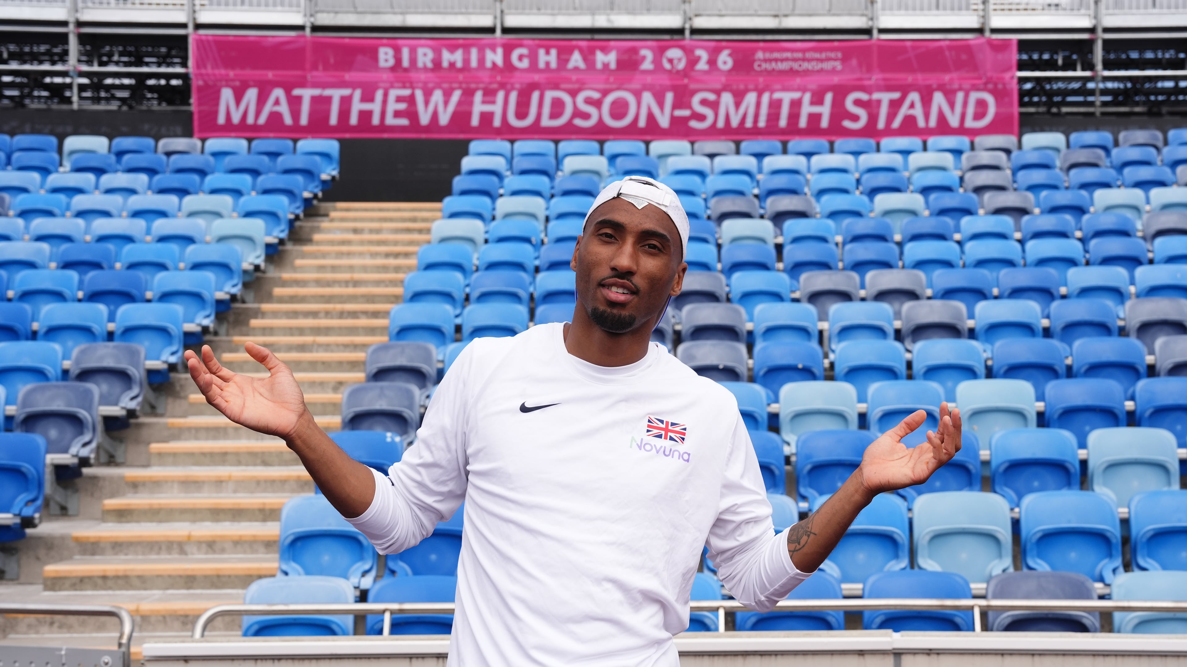 Britain's Matthew Hudson-Smith poses in front of a stand named after him, during a training session ahead of the start of the European Athletics Championships, in Birmingham, England, Sunday, Aug. 9, 2026. (Martin Rickett/PA via AP)