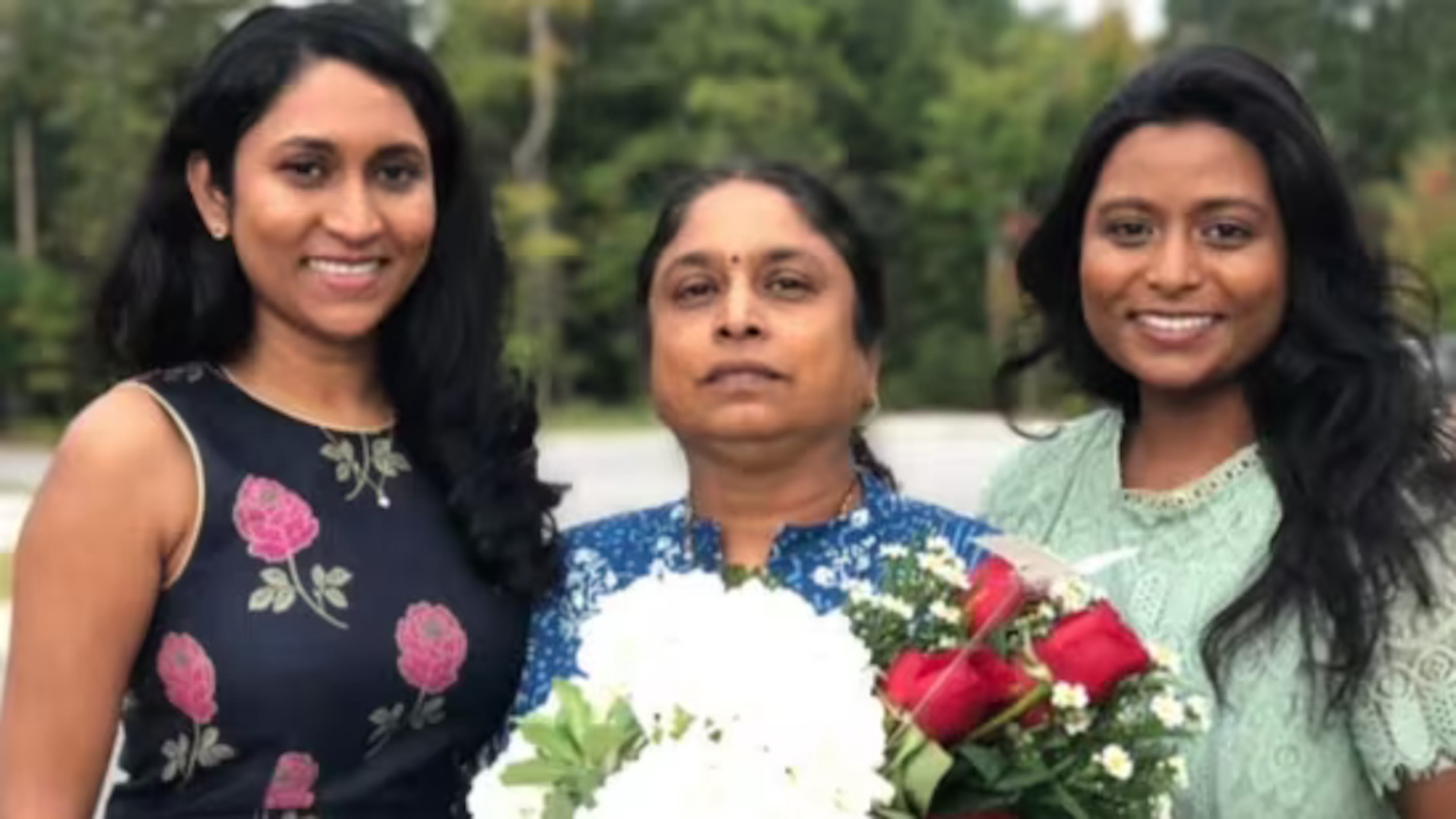 Venkata Vasamsetty, center, with her two daughters. Vasamsetty has lived legally in the country with a green card for 30 years and is a public school special education teacher. She is now in ICE custody. (Courtesy of Helen Parsonage)