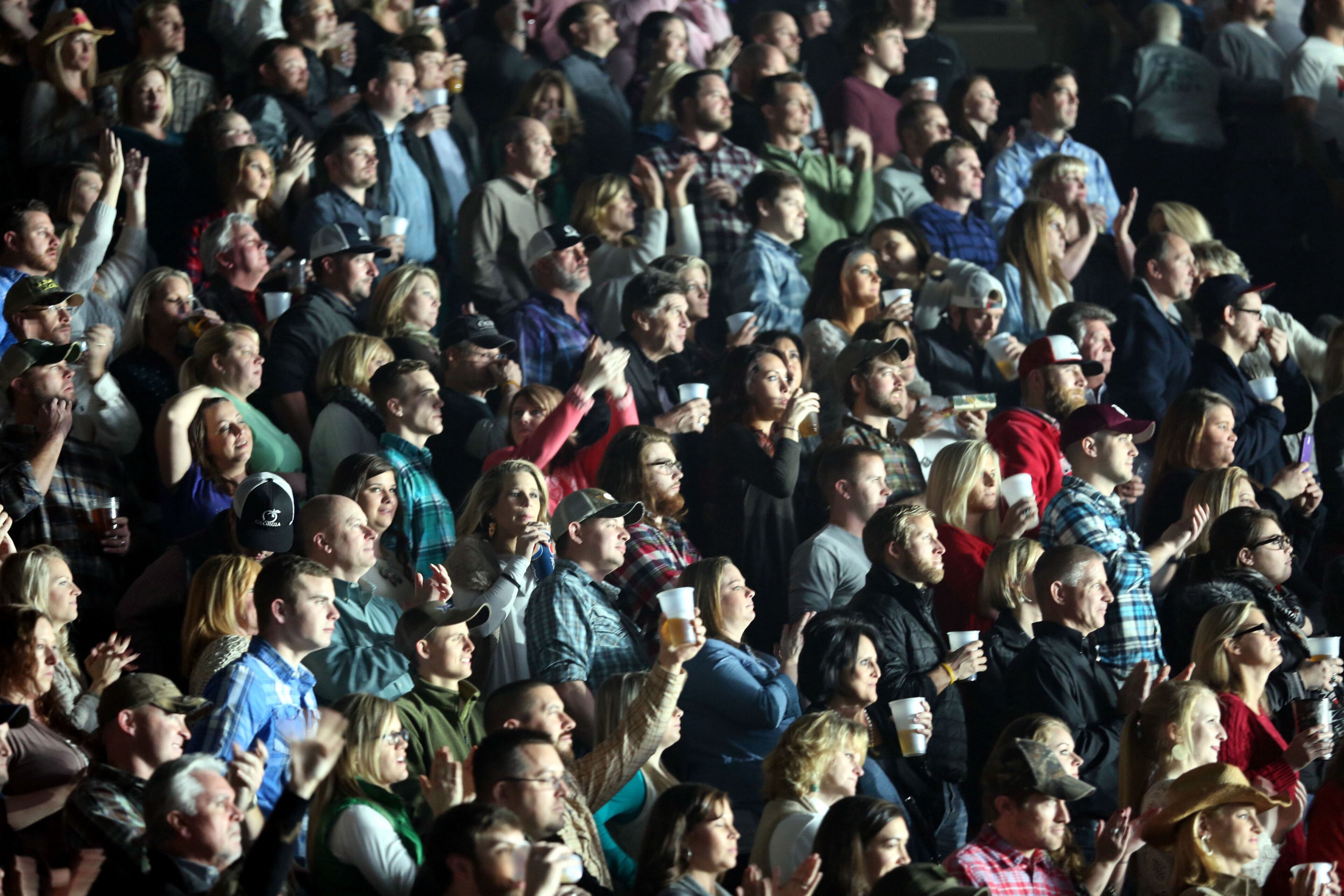 The crowd reacts to Eric Church's performance at a sold-out The Arena at Gwinnett Center in Duluth Thursday, Dec. 11, 2014 before Eric Church takes the stage. Robb D. Cohen/RobbsPhotos.com