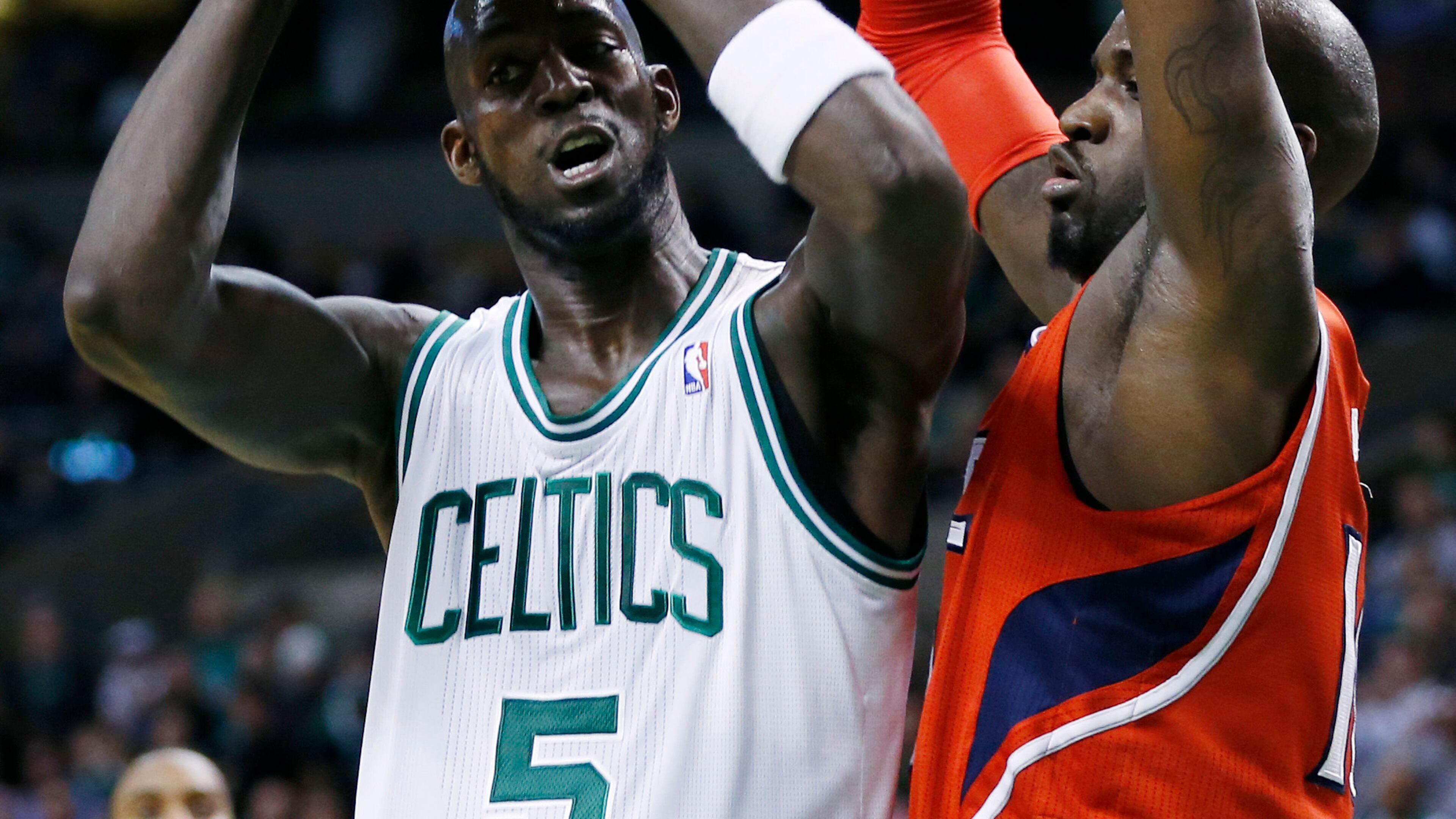 Hawks' Johan Petro (right) blocks a shot by Boston Celtics' Kevin Garnett.