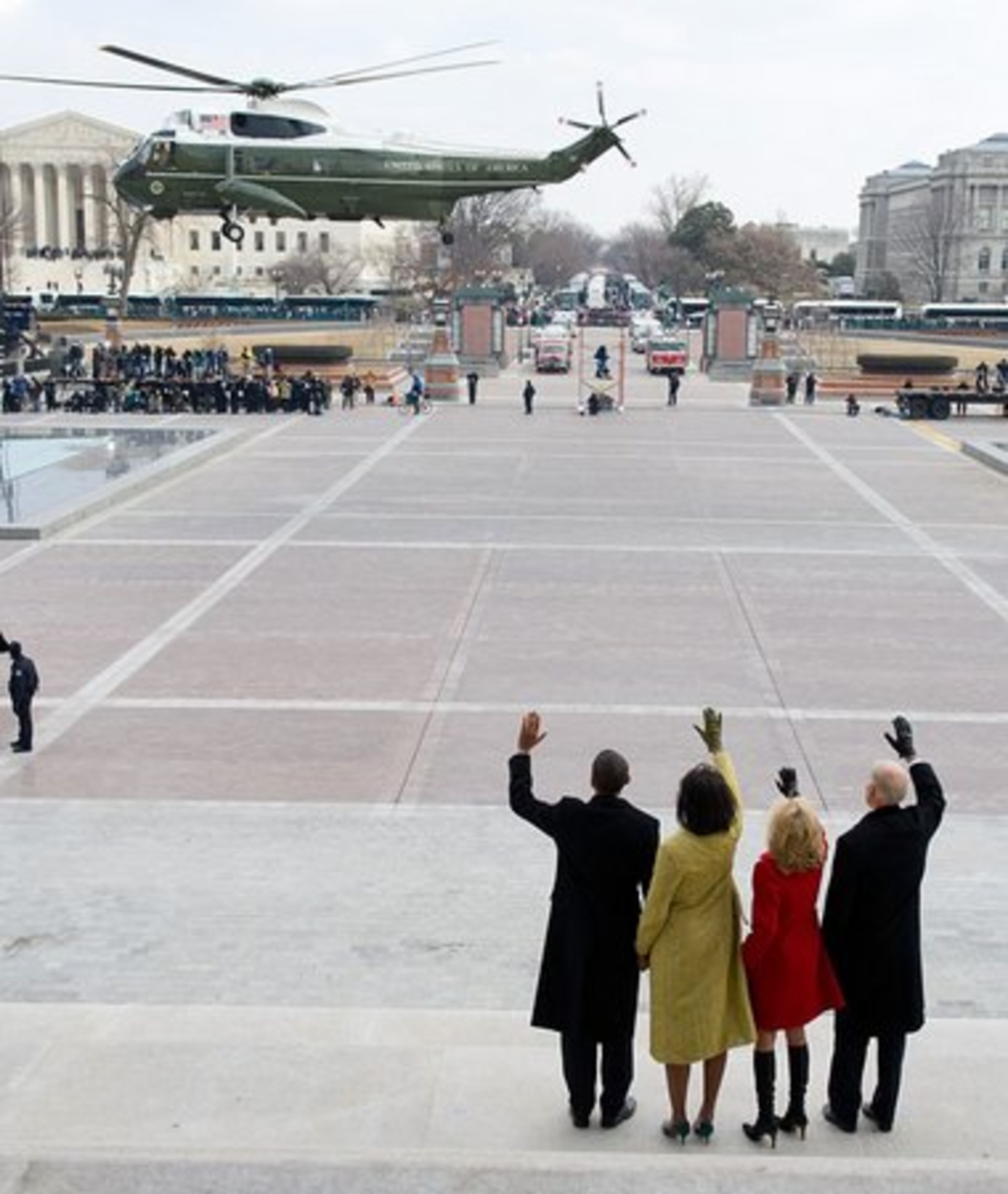 The Obamas and the Bidens wave as former President Bush and wife Laura leave the Capitol by helicopter.