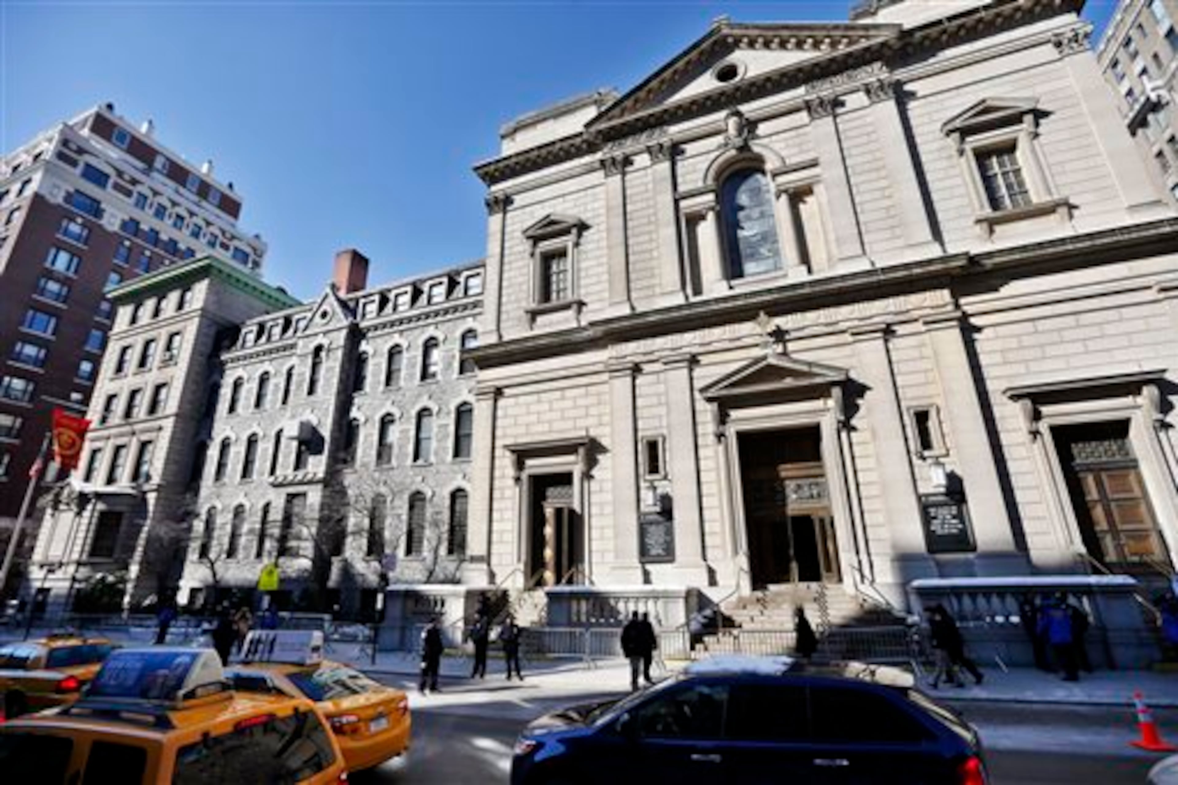 Barricades are placed outside of the Church of St. Ignatius Loyola before the funeral of actor Philip Seymour Hoffman Friday, Feb. 7, 2014, in New York. Hoffman, 46, was found dead Sunday of an apparent heroin overdose. (AP Photo/Jason DeCrow)