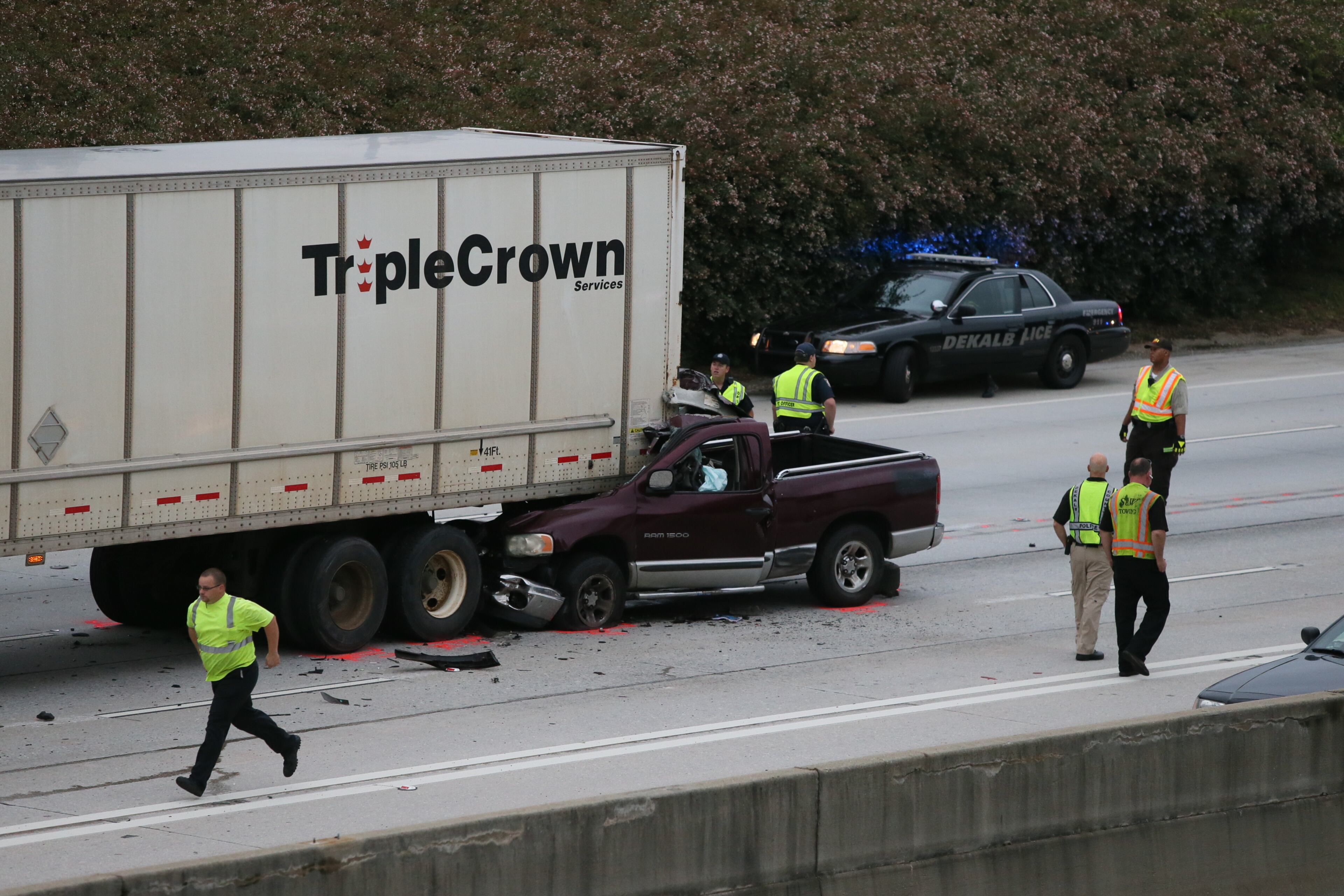 The WSB 24-hour Traffic Center reported that a pickup truck ran under the back of the tractor-trailer. BOB ANDRES/BANDRES@AJC.COM