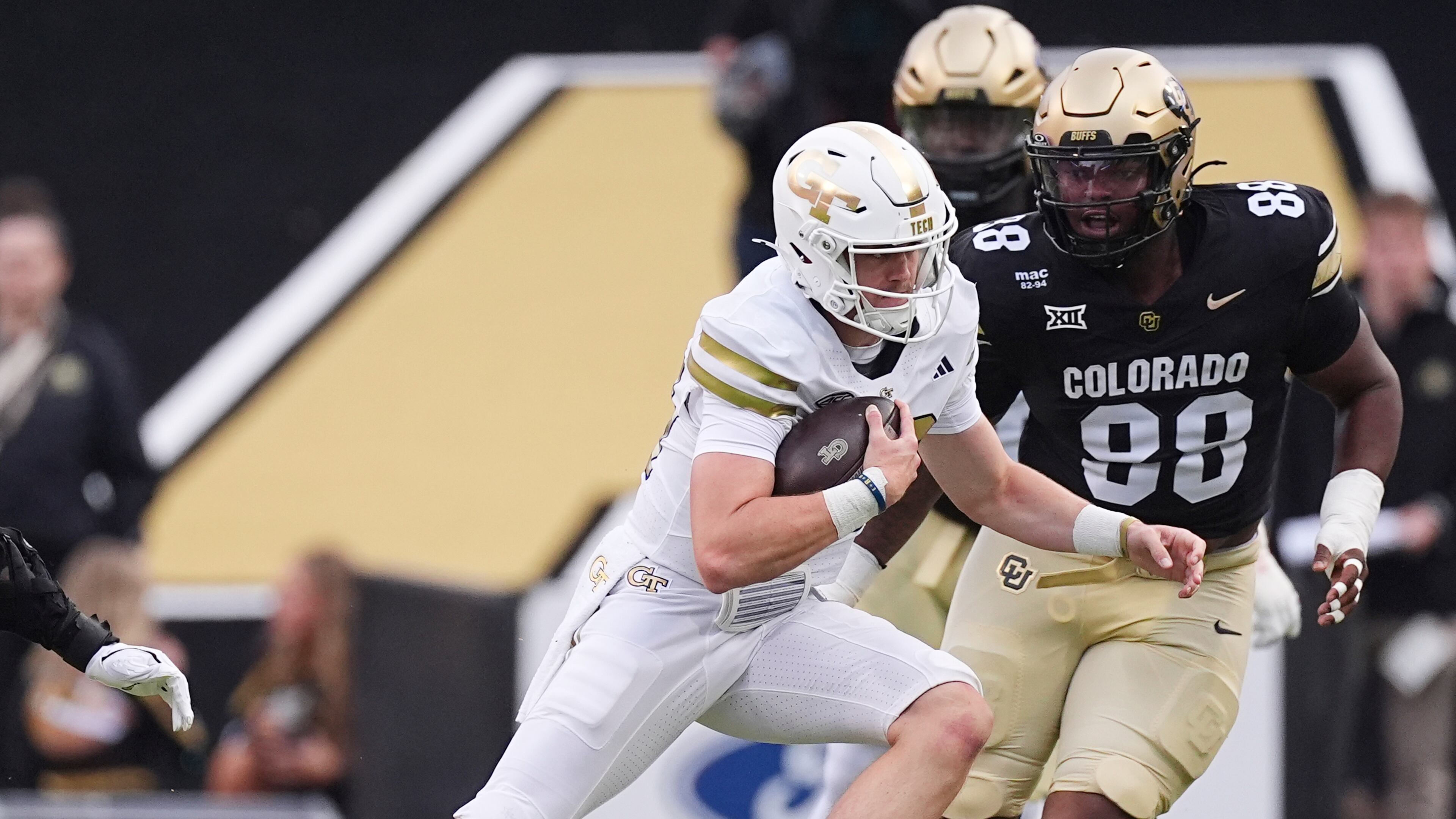 Tech quarterback Haynes King (left) runs for a short gain on Friday, Aug. 29, 2025, in Boulder, Colo. “We challenged them this week,” King said of his offensive line. “I think we did a really good job of challenging them and they answered it. Y’all saw what happened.” (David Zalubowski/AP)